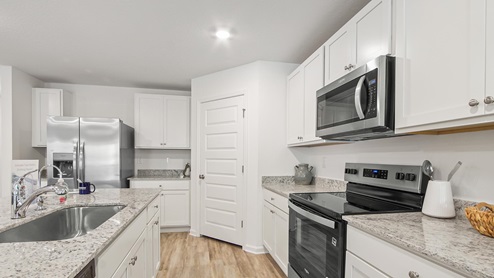 Elegant interior features include granite countertops