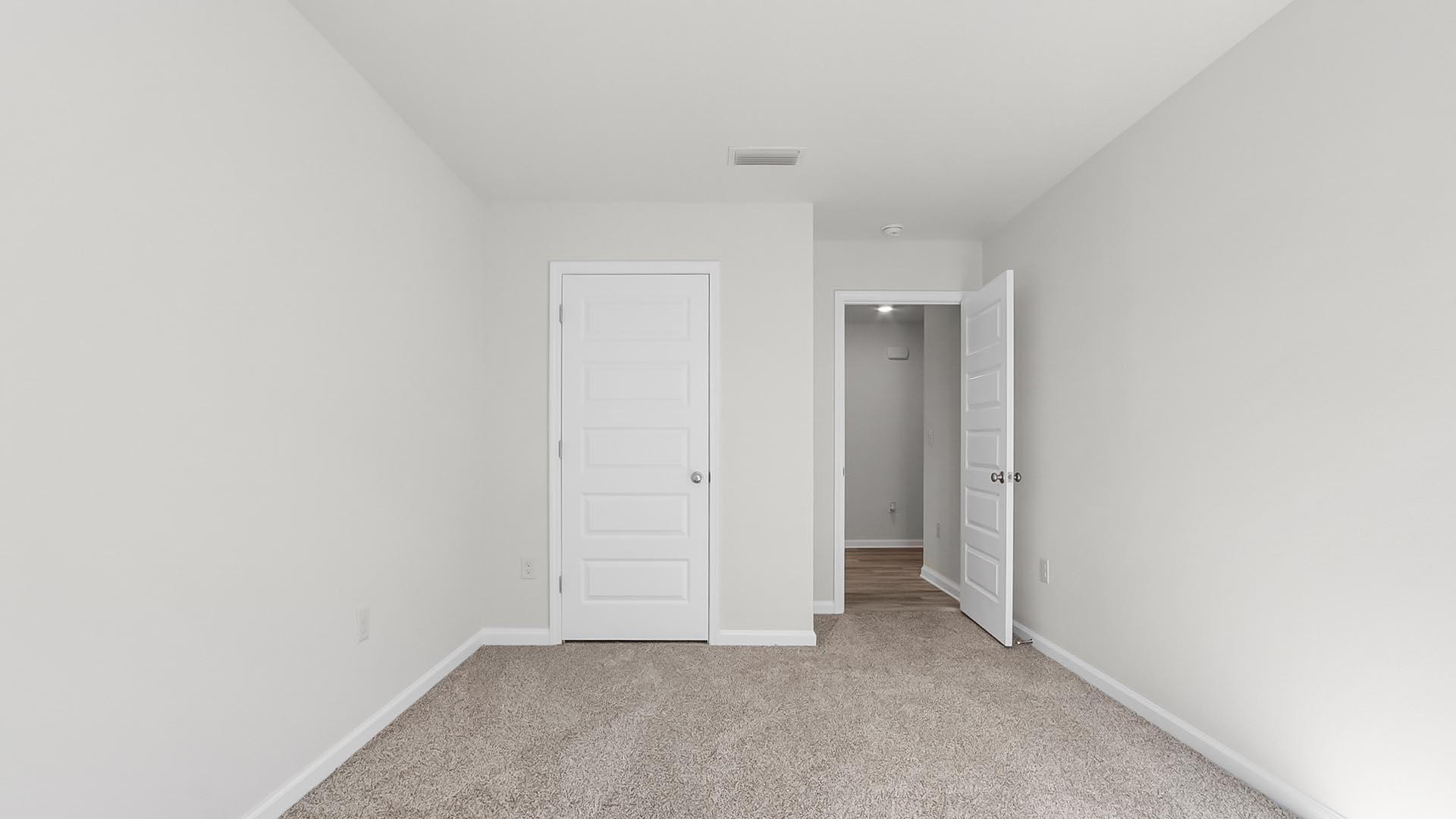 Bedroom two has plush carpet and a spacious closet