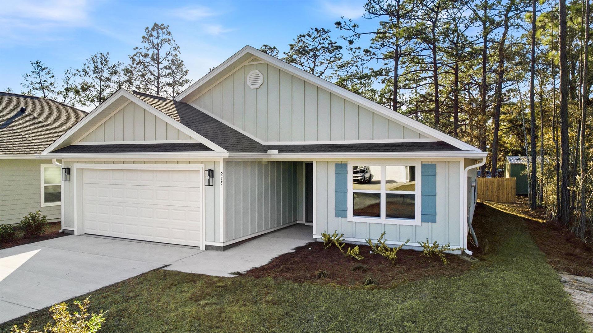 Covered entry at the front door and a two car garage