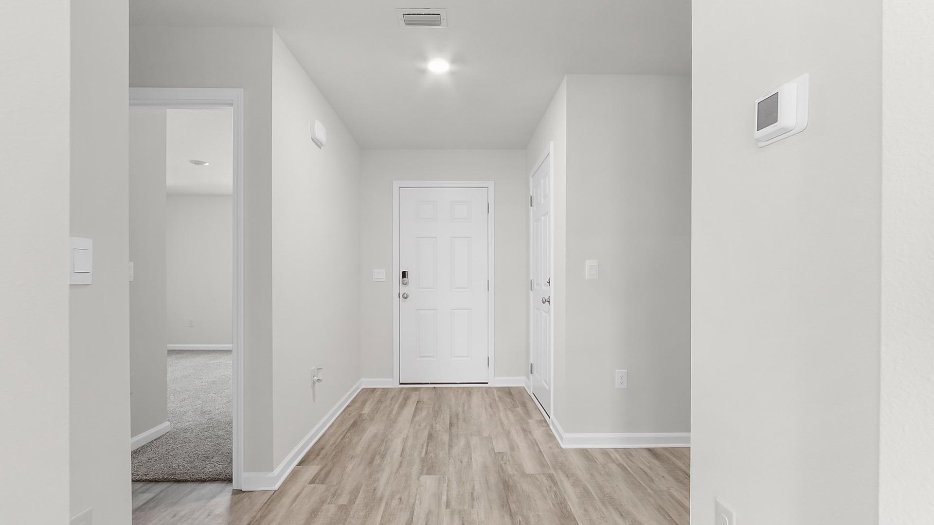 Hall leading to additional bedrooms