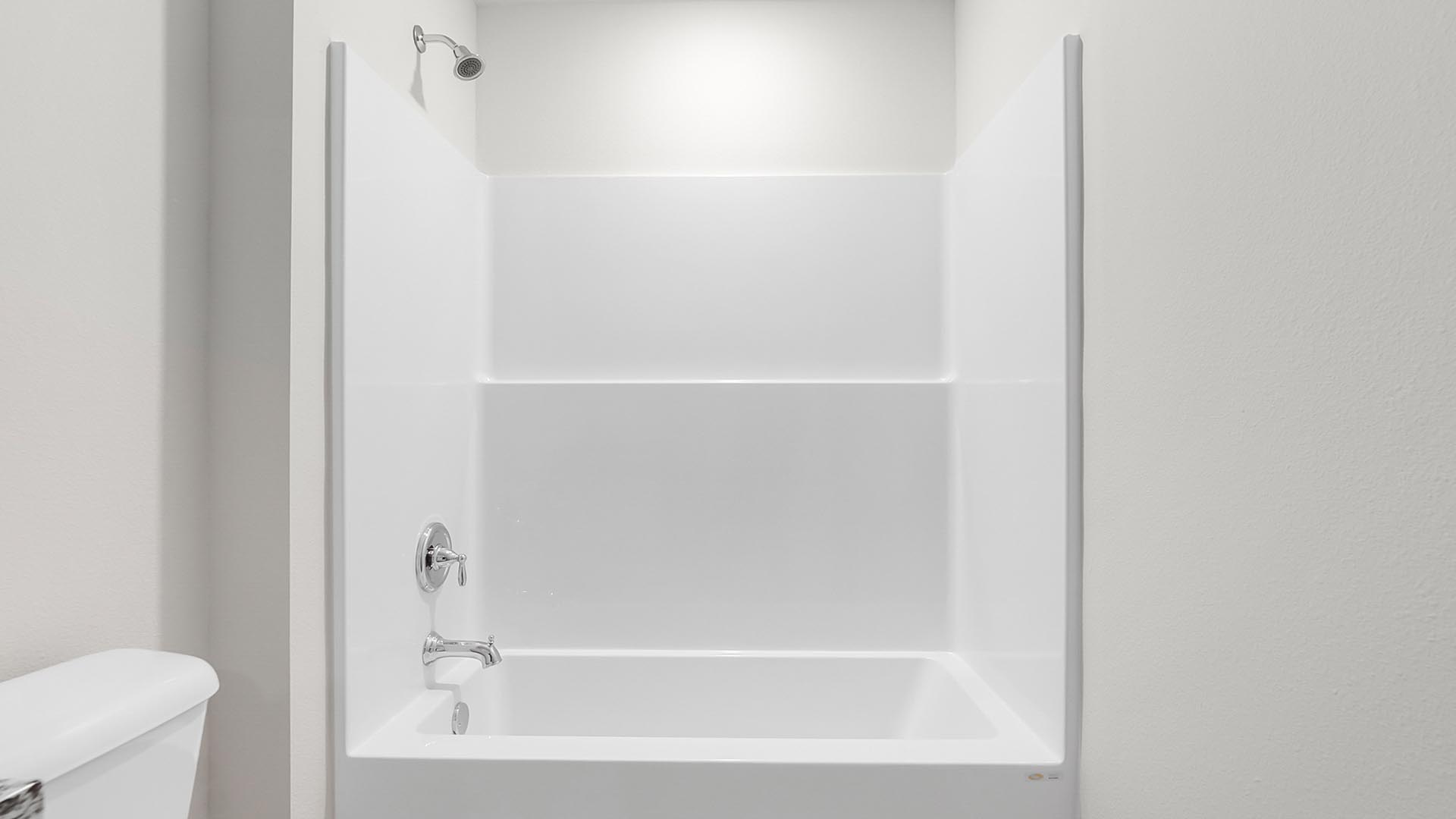 The shared bathroom has a shower tub combination