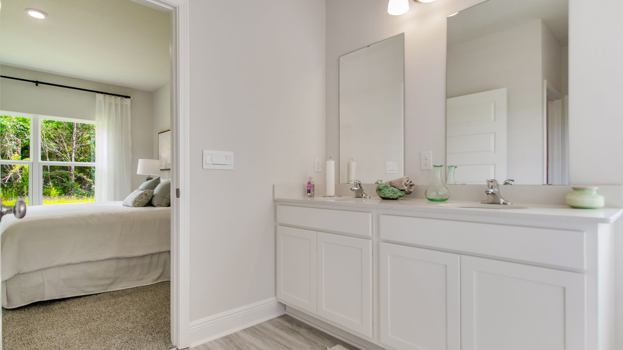 The vanity has quartz countertops