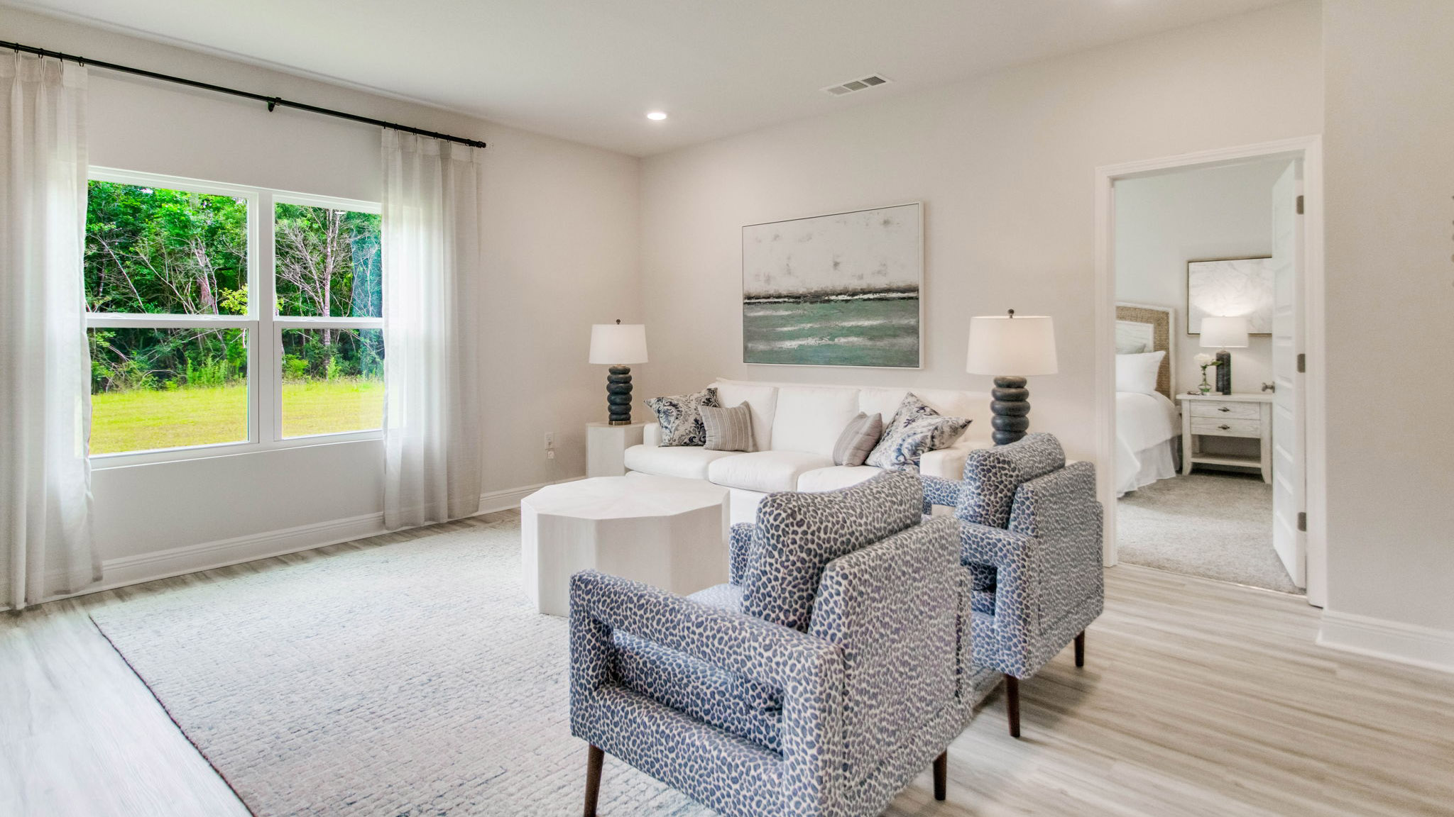 The living area has a large picture window