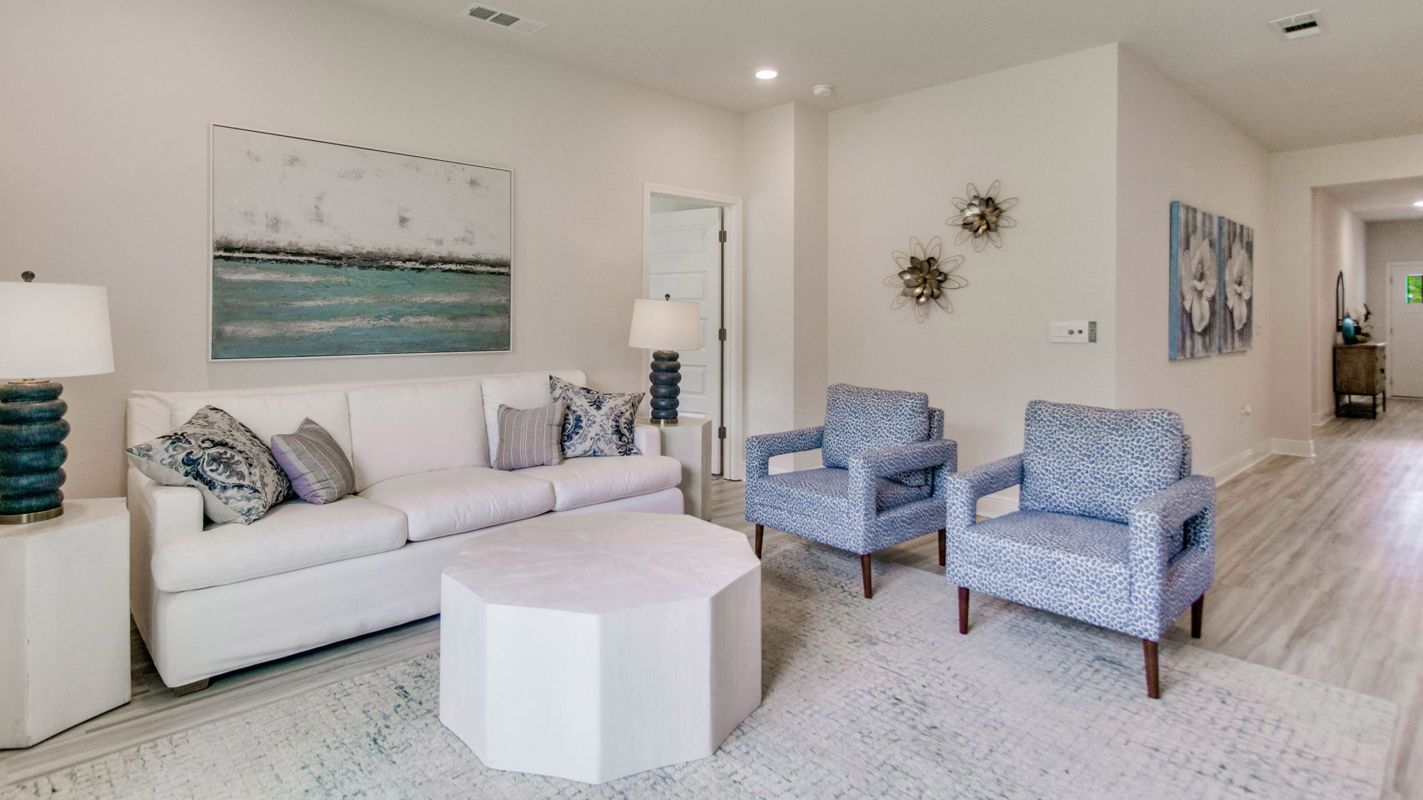 The living area fits a sofa two chairs and coffee table