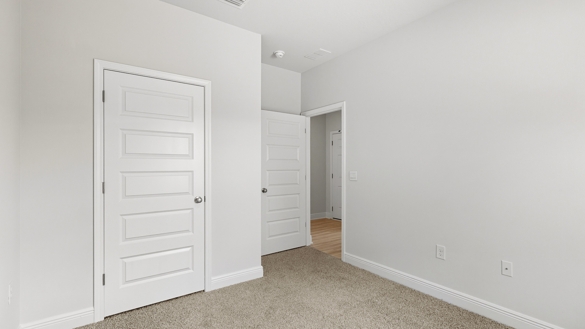 Bedroom five is located at the front of the home