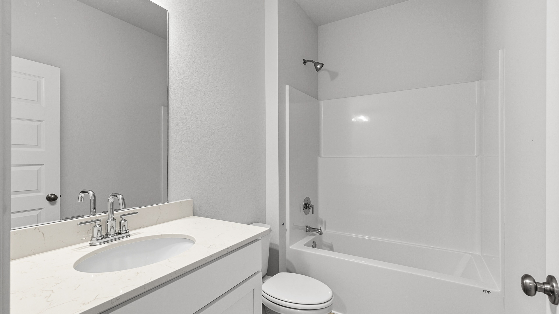 A shared bathroom is in between both bedrooms