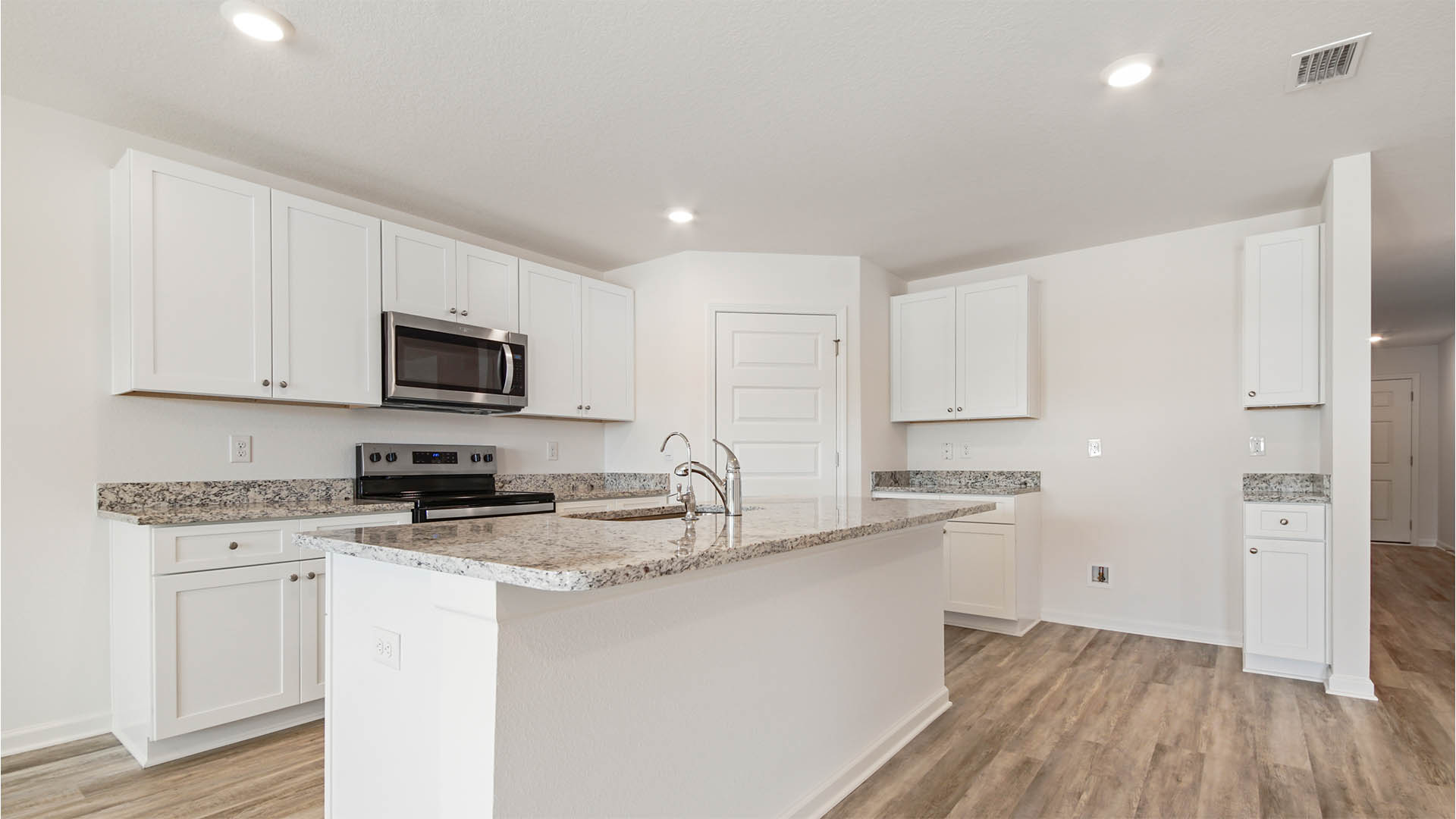 Name brand stainless steel appliances include a stove microwave and dishwasher