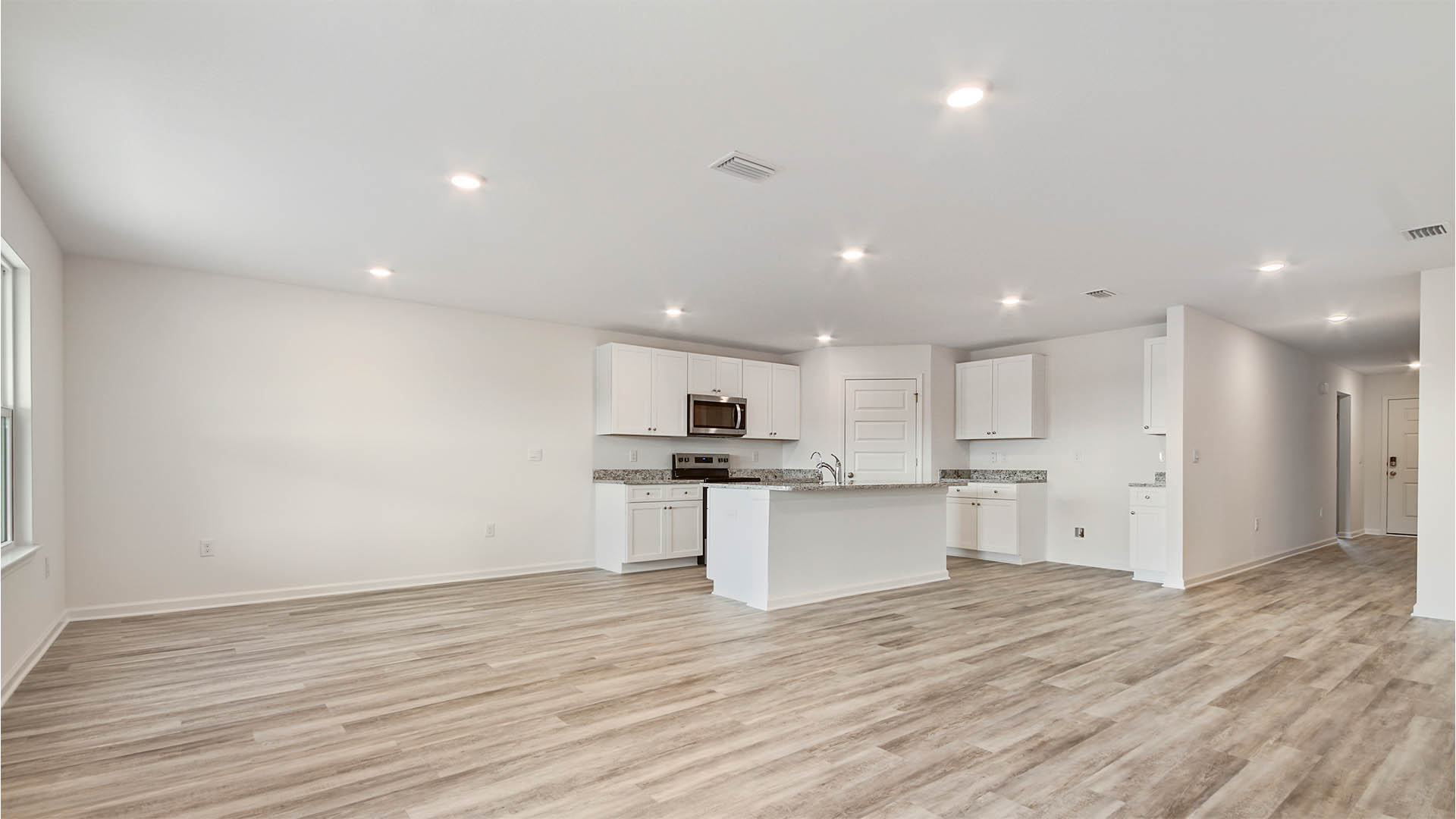 The open kitchen features a spacious pantry