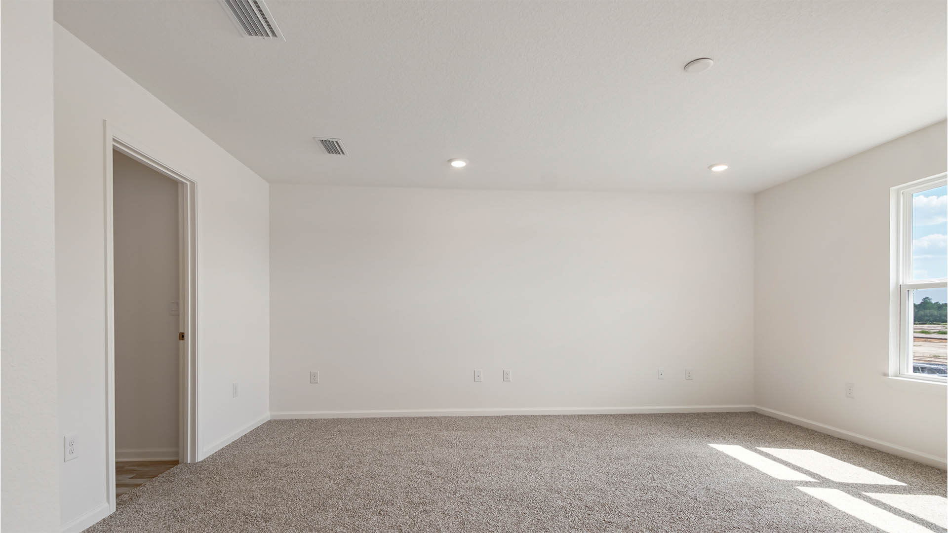 Primary bedroom has double windows for plenty of natural light