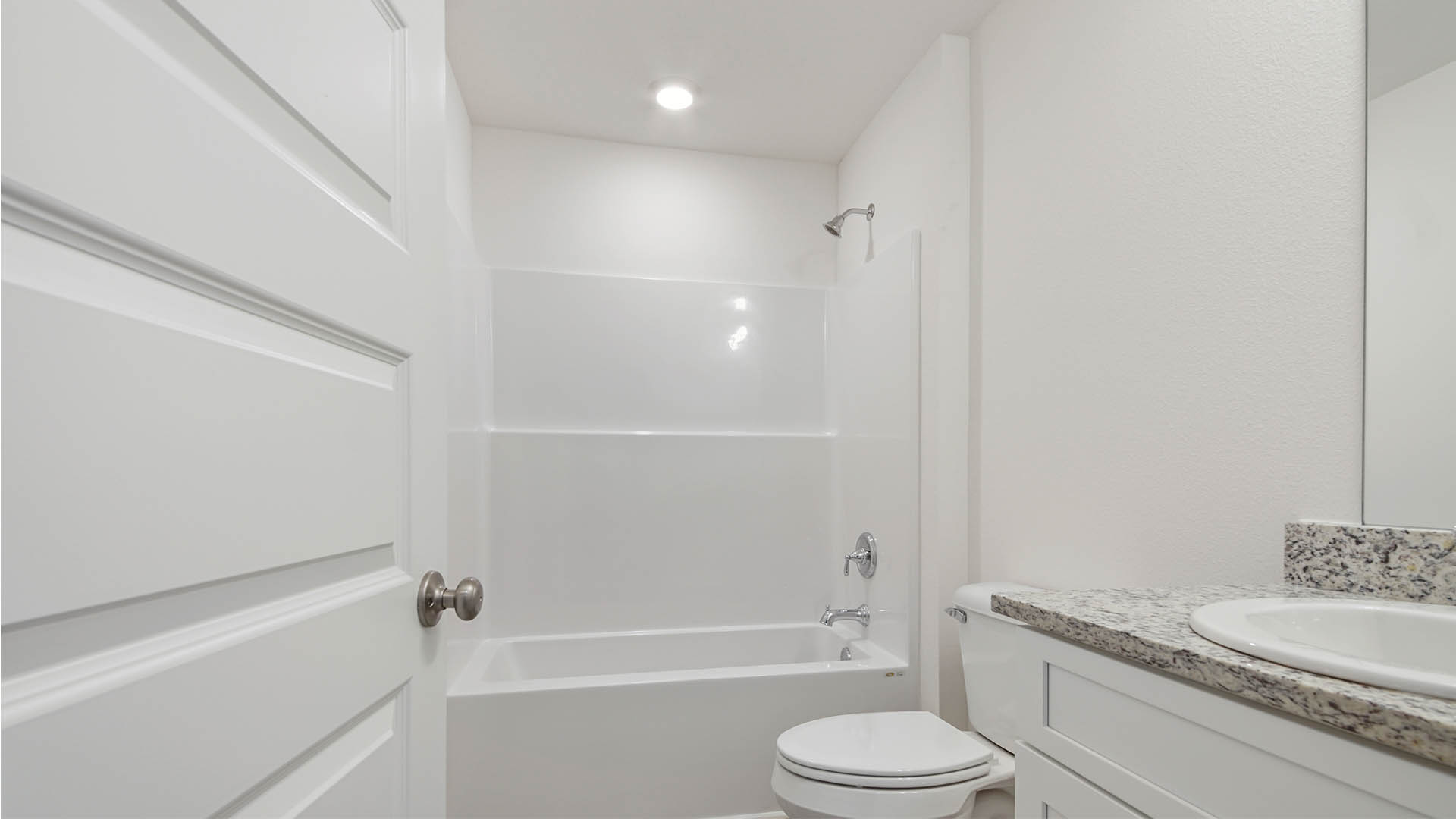 Shared bathroom features a shower tub combination