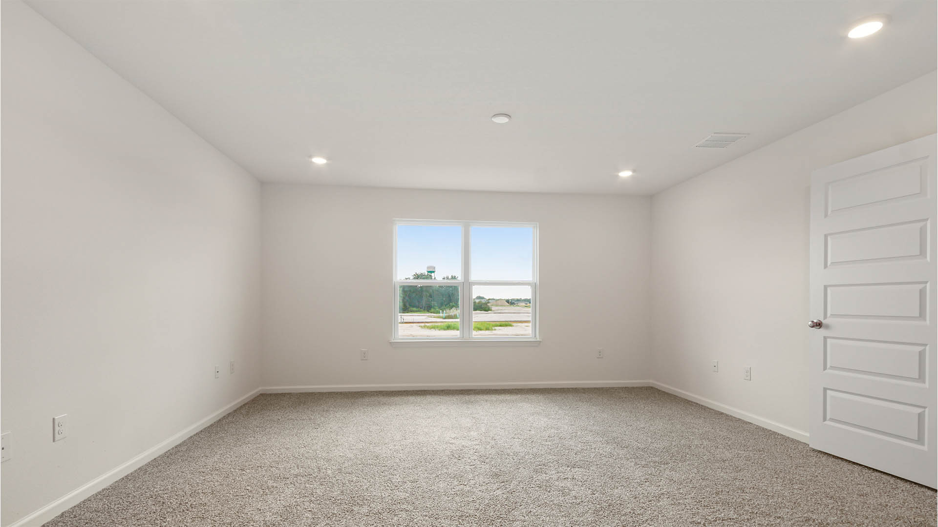 The primary bedroom has a private bath with two walk in closets