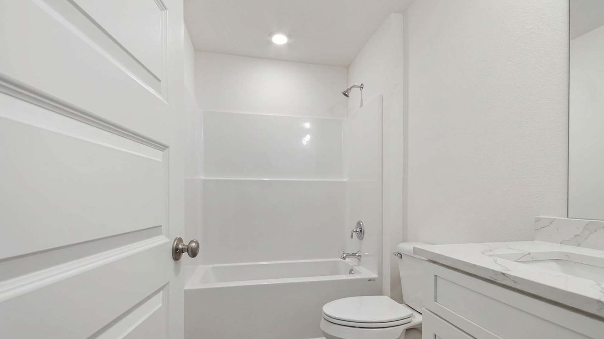 Shared bathroom features a shower tub combination