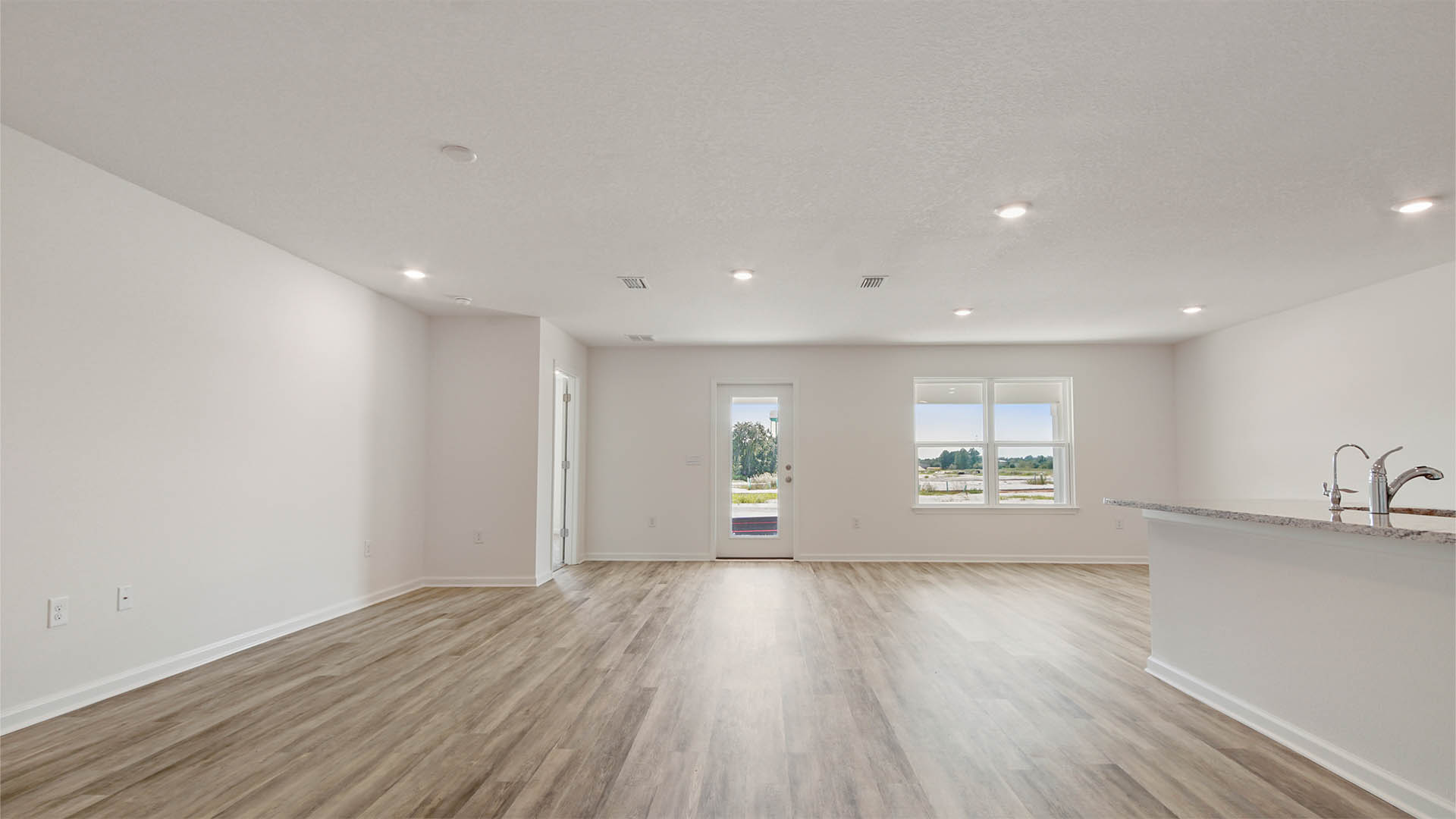 Open and spacious living area with 8 foot ceilings
