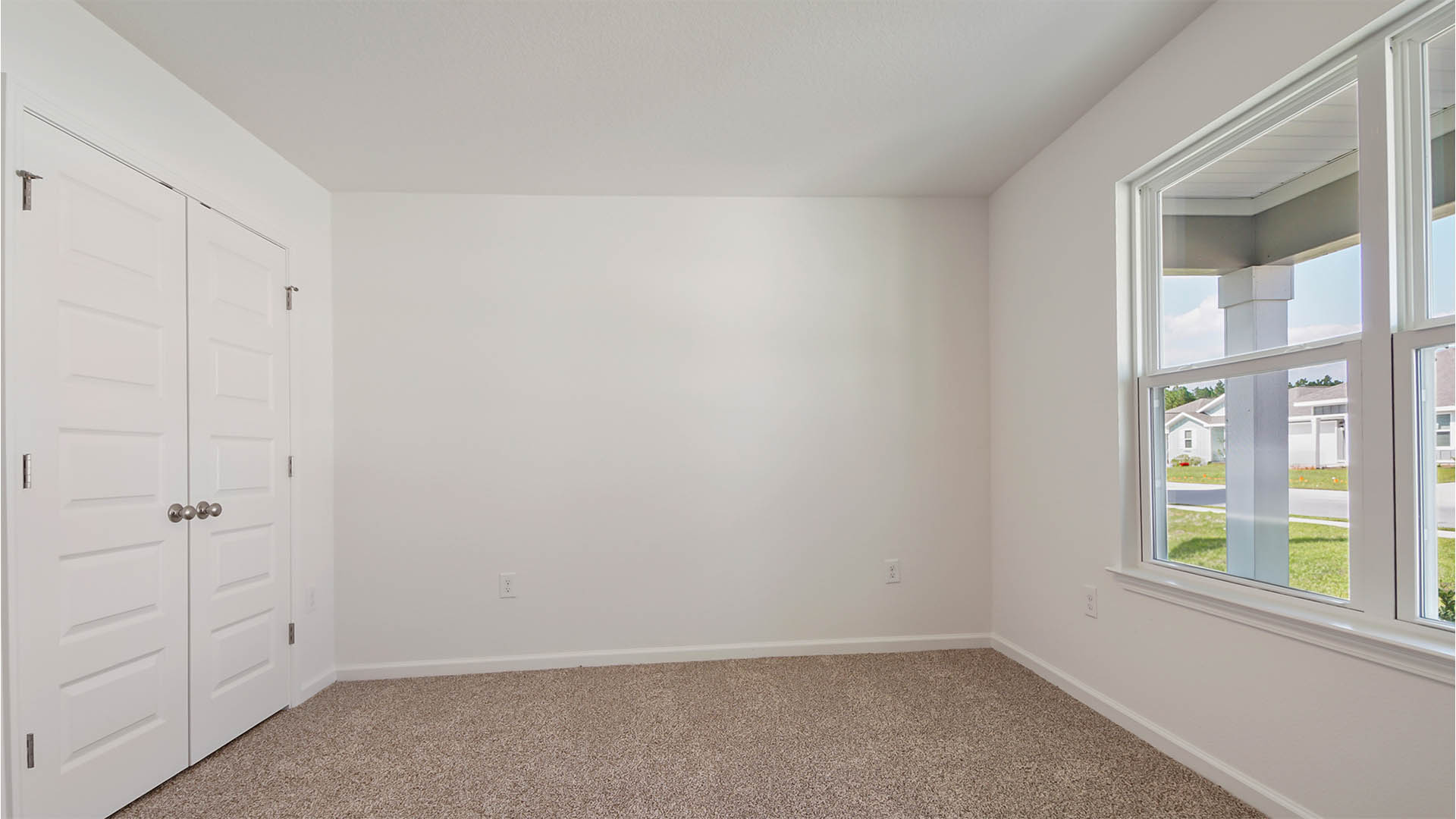 Bedroom two is located at the front of the home and could be used as an office