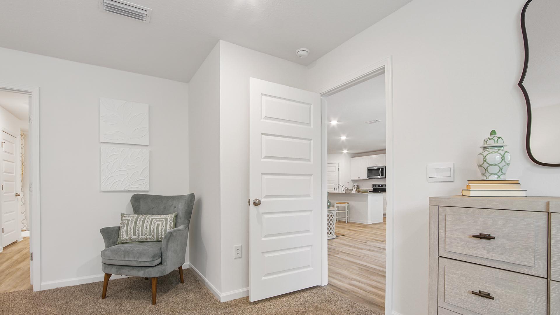 Primary bedroom is located off the great room