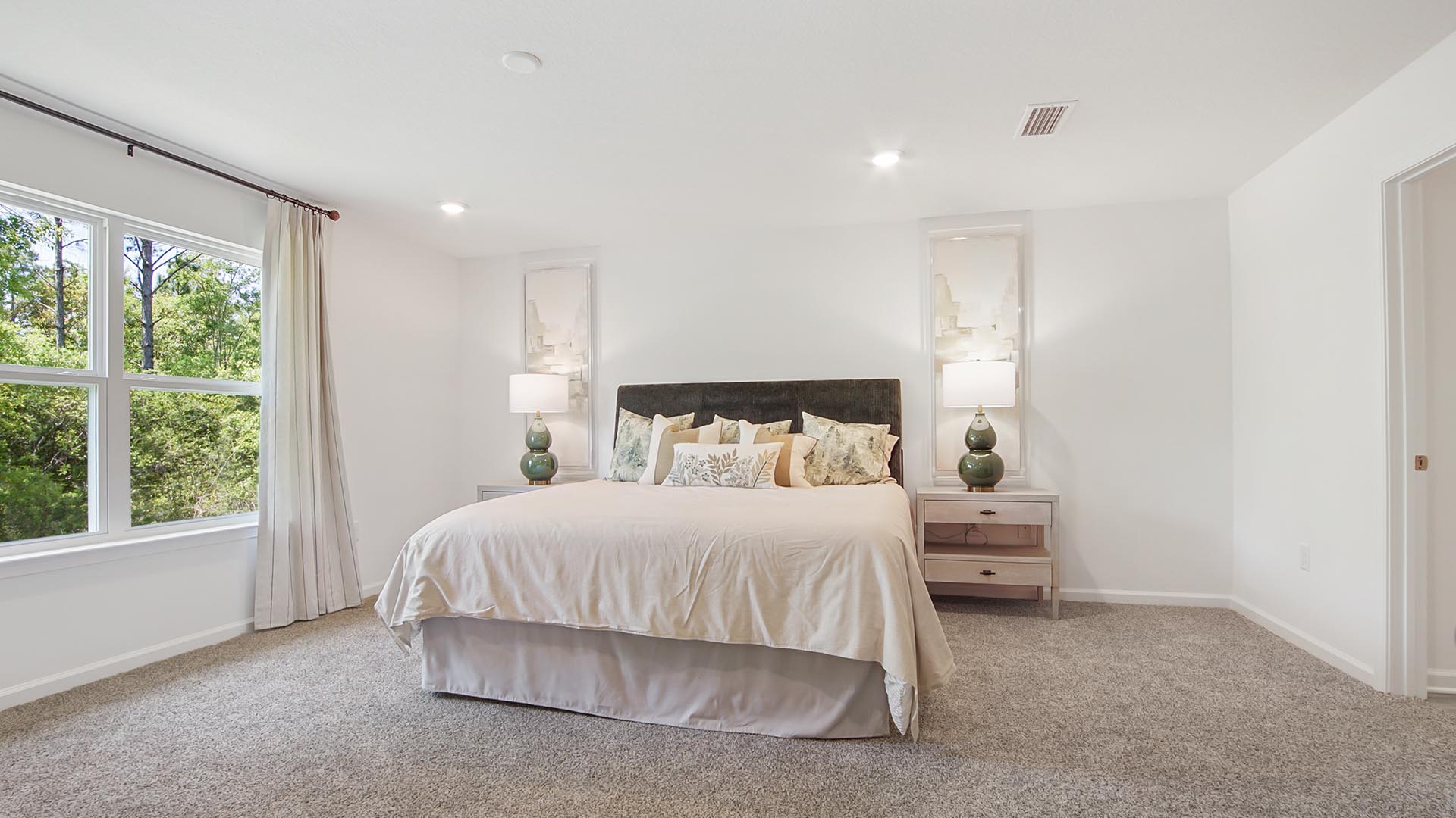 Primary bedroom is located off the great room