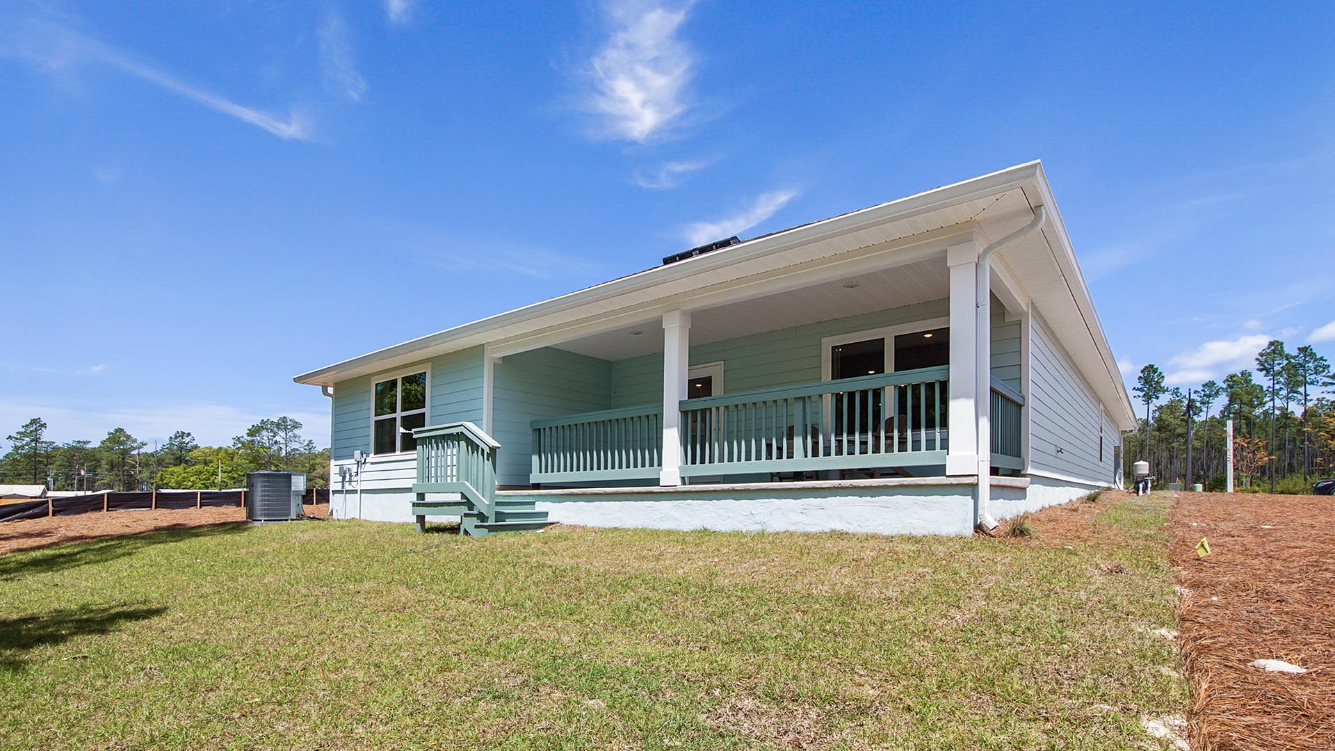 Back patio with railing of the model home