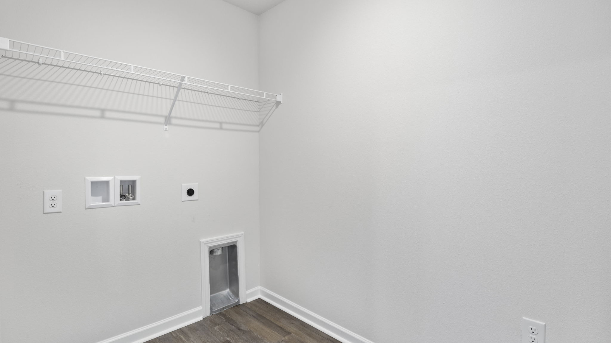 The laundry room is located off the kitchen