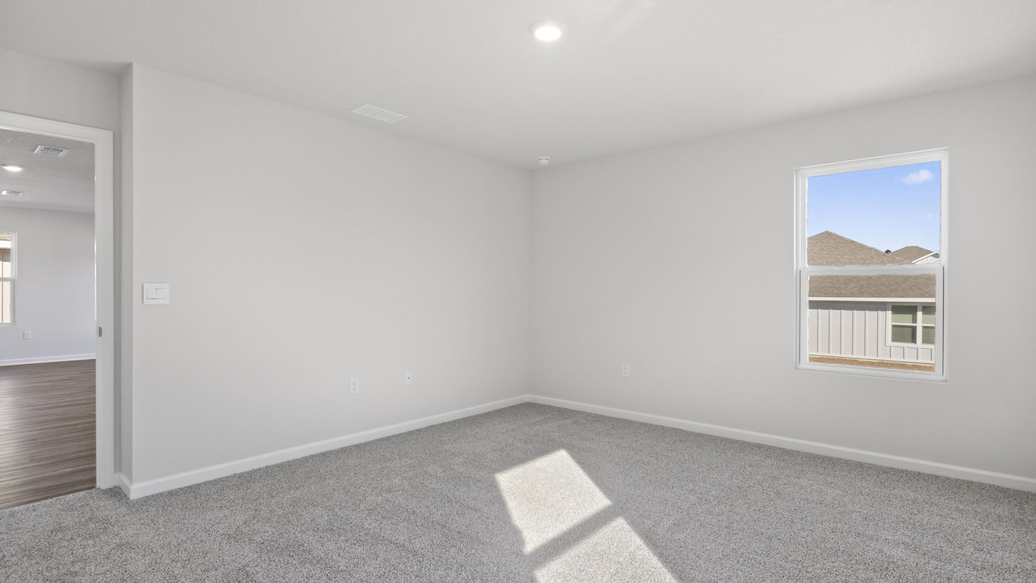 The primary bedroom is located off the living area