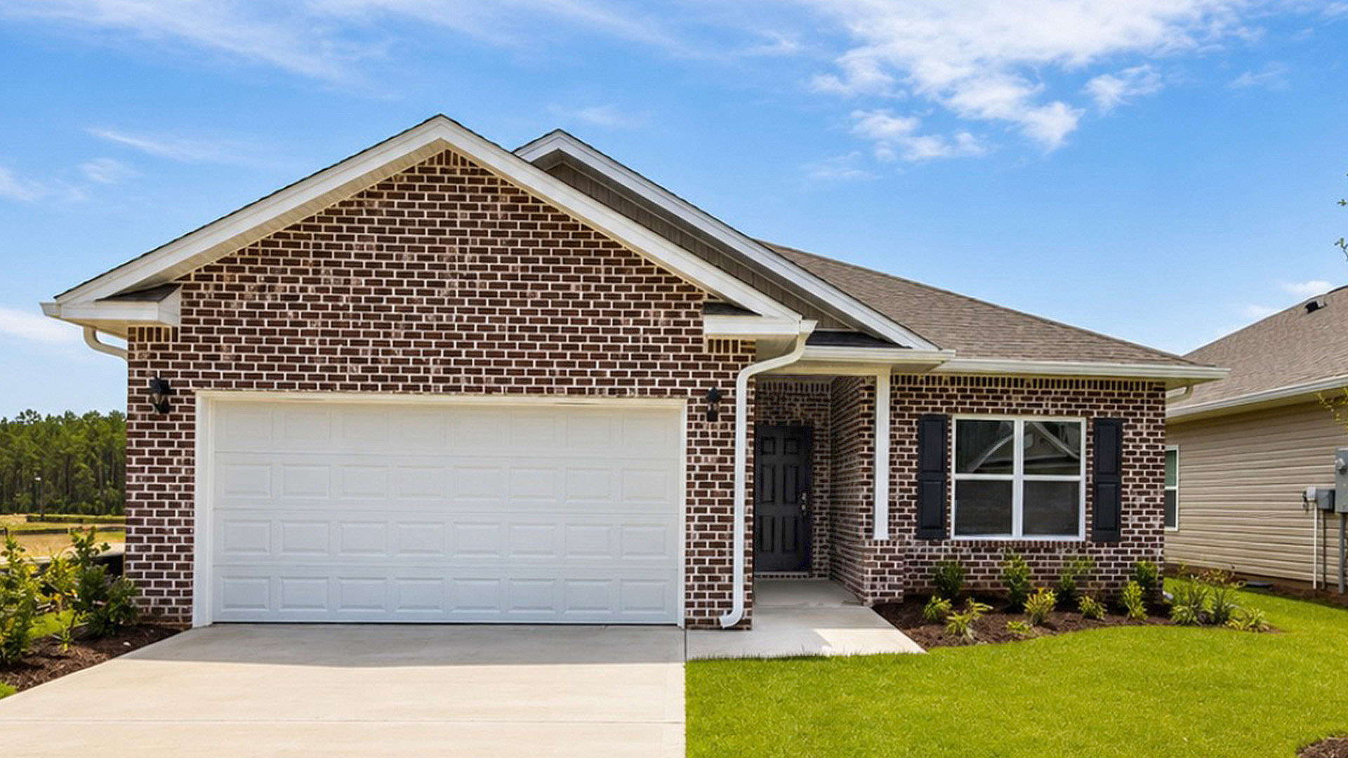 The Walker at Ashton Park is in the newest phase. It has brick exterior on the front and three sides vinyl. It features three bedrooms and two full bathrooms