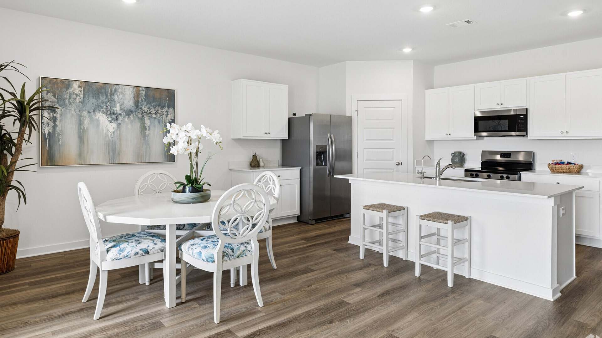 The kitchen of the Beau has a center island and a corner pantry for storage