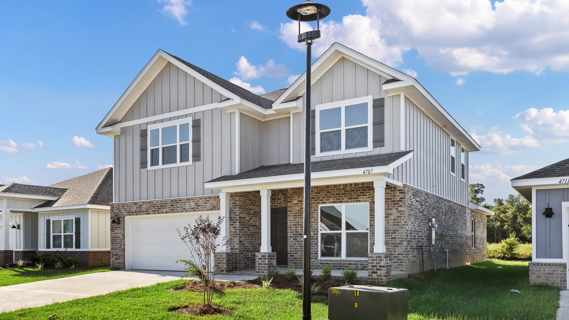 The Embry has a brick exterior on level one and covered front porch and entry