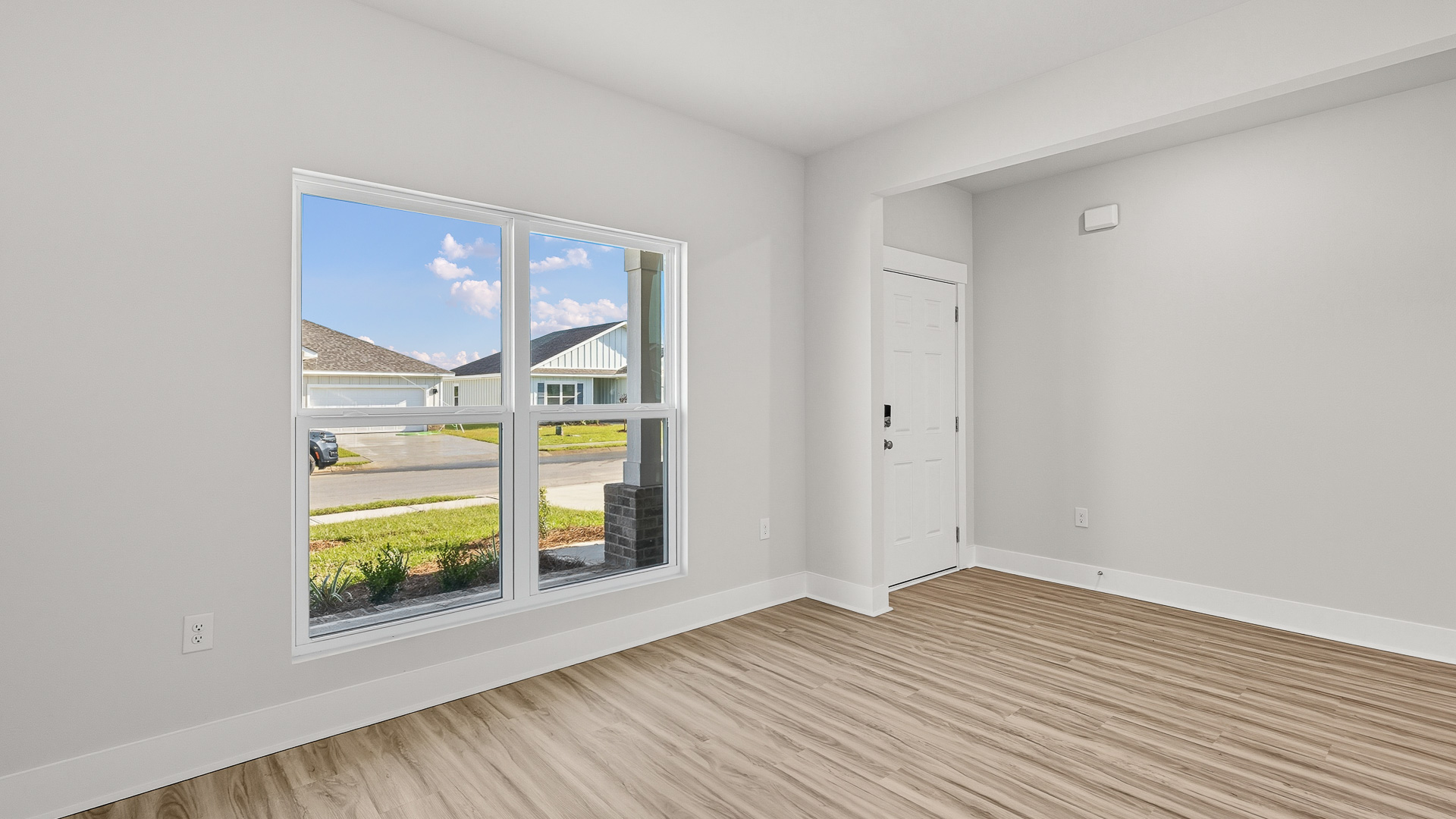 The flex space could serve as a home office or a formal living area