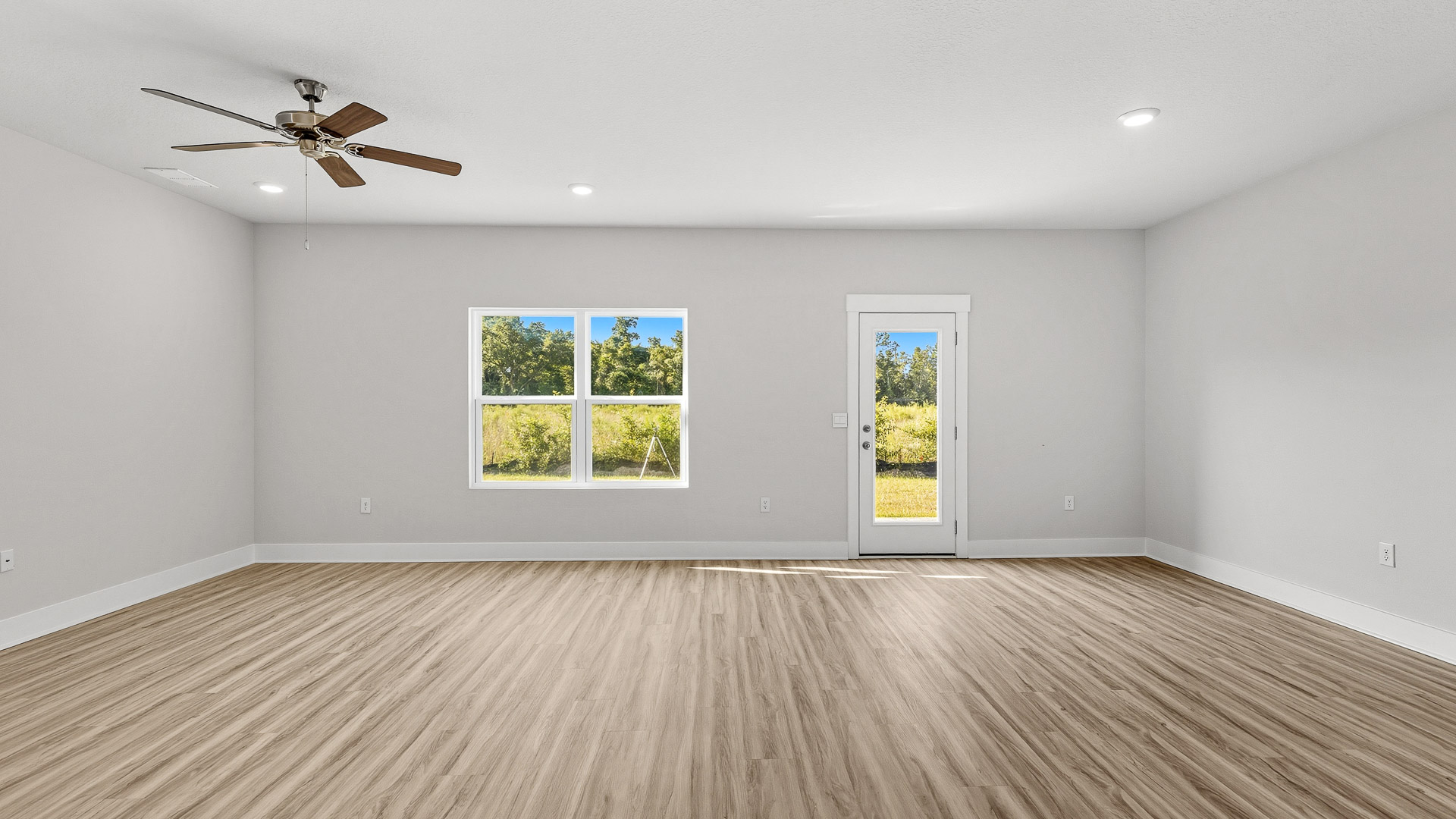 The living area allows for access to the back patio