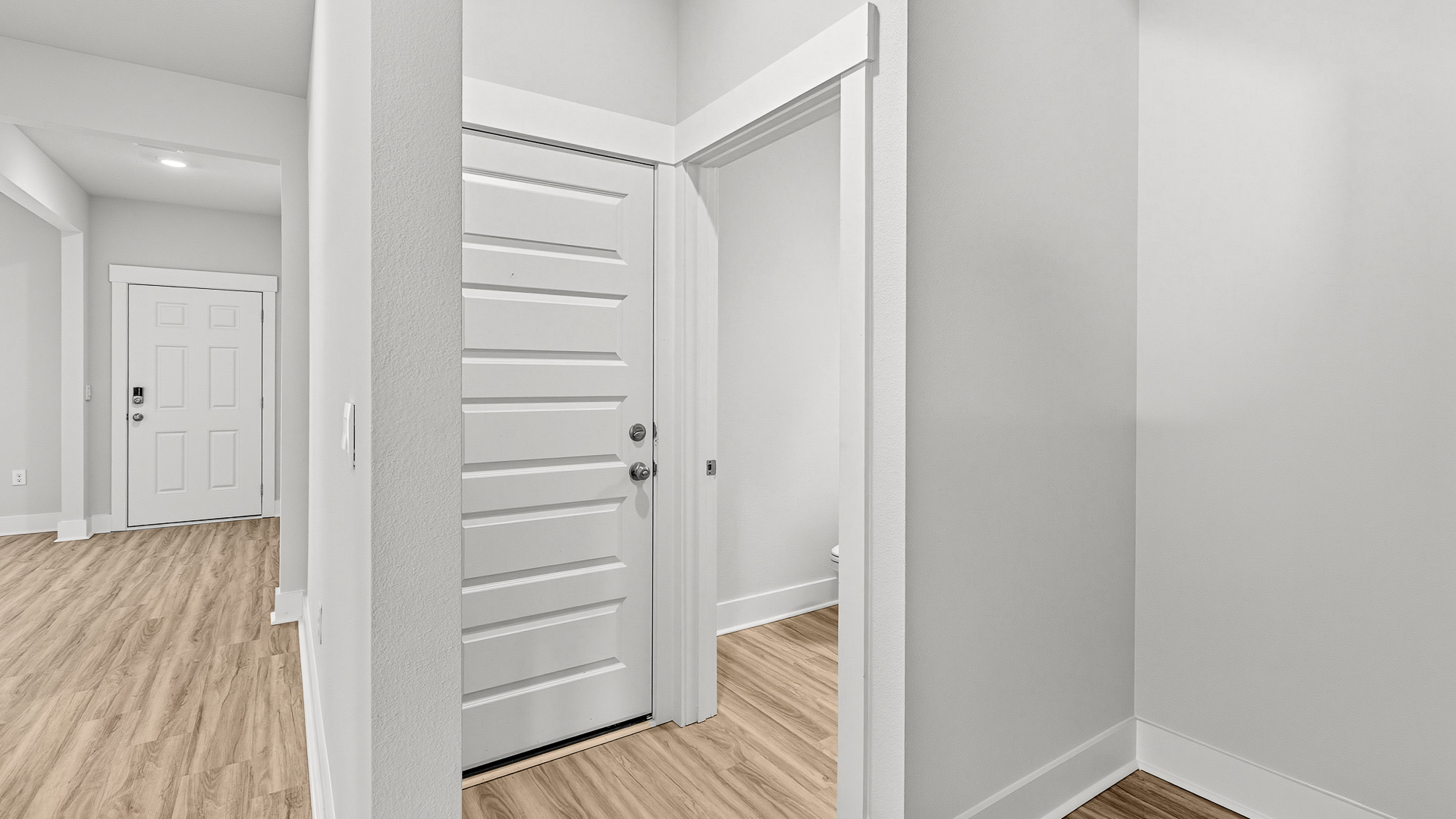 There is a downstair powder room off the stairs and garage access