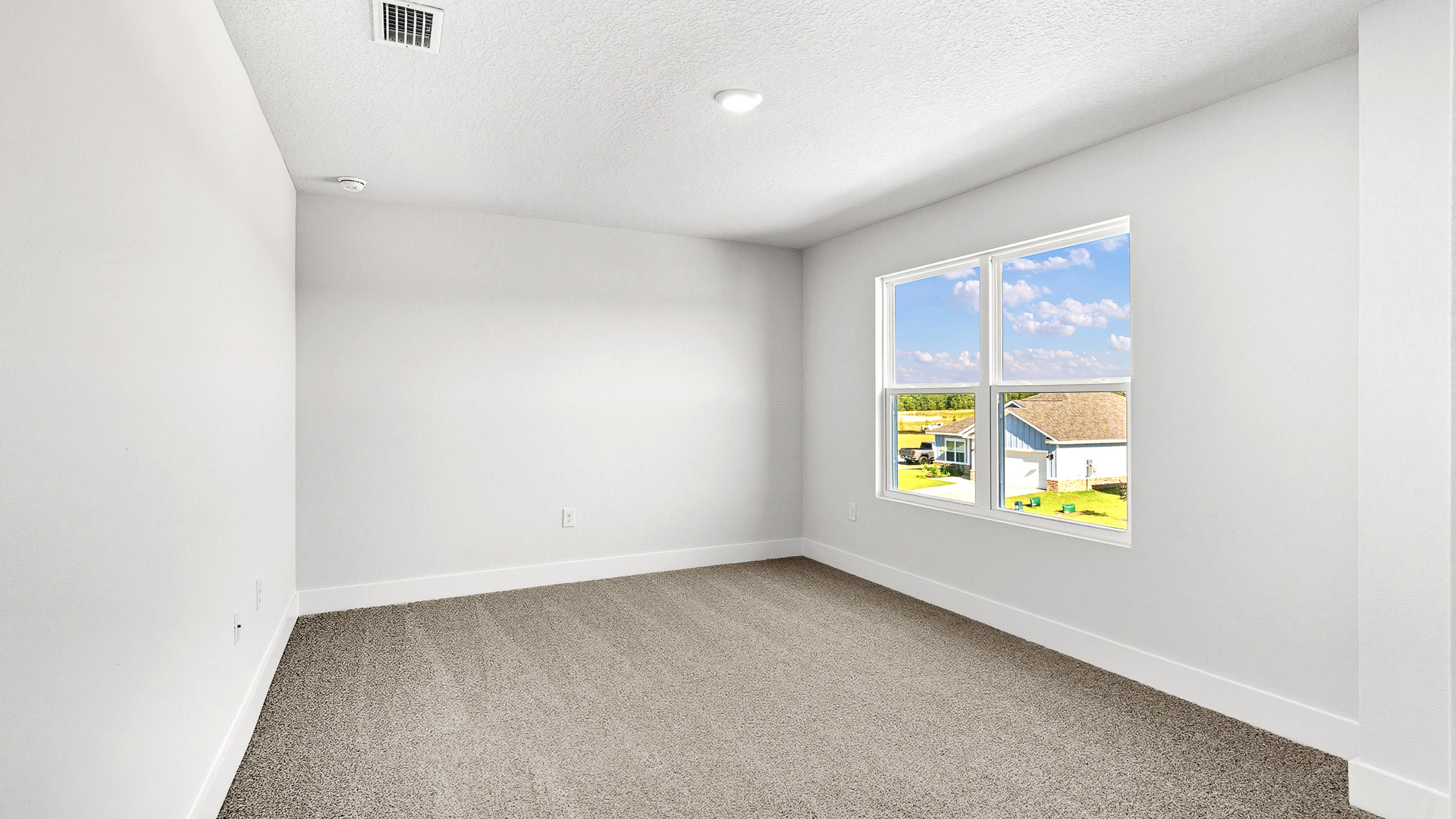 Two of the guest bedrooms are located overlooking the front of the home