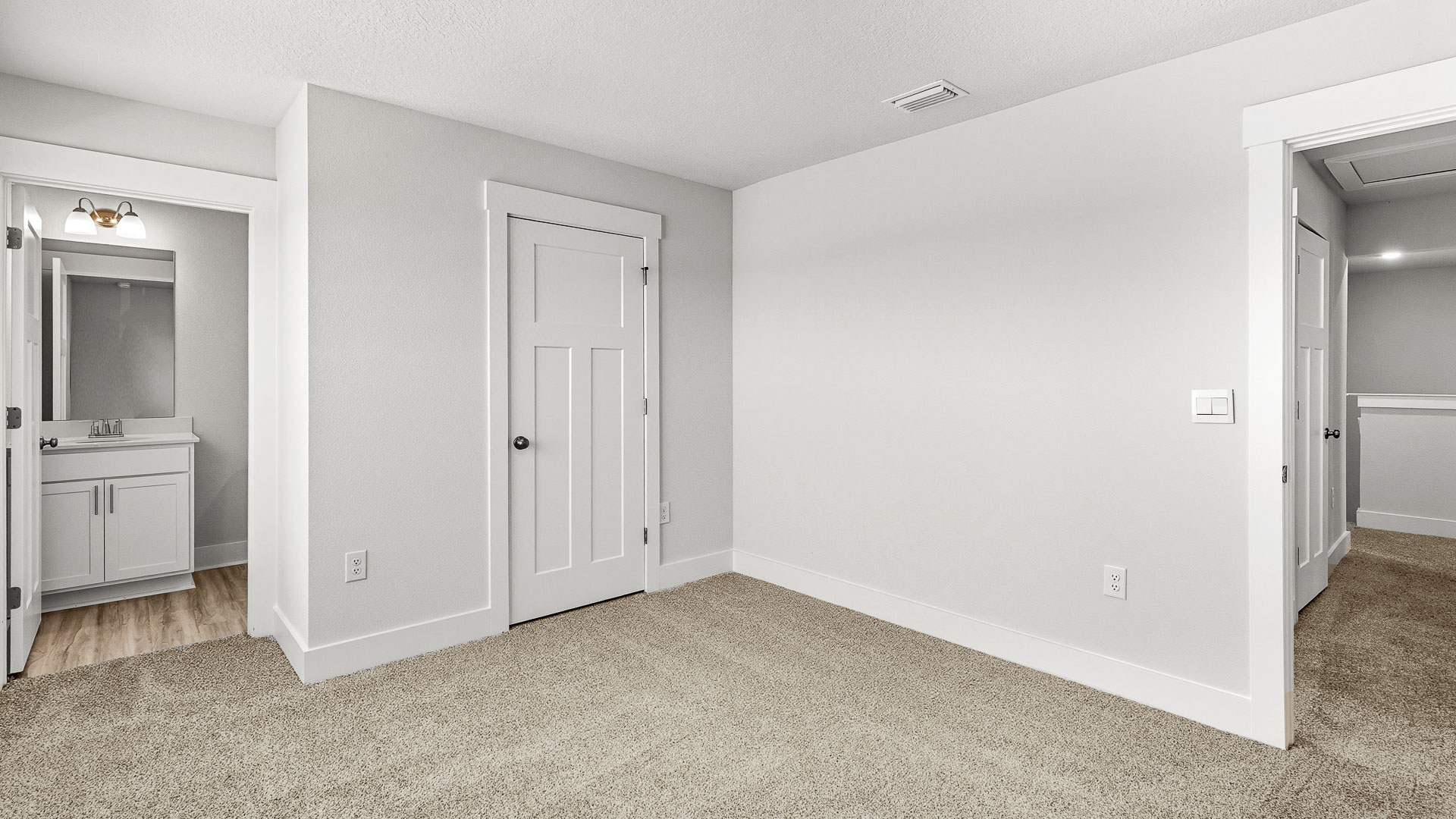 One of the guest bedrooms has a private bathroom