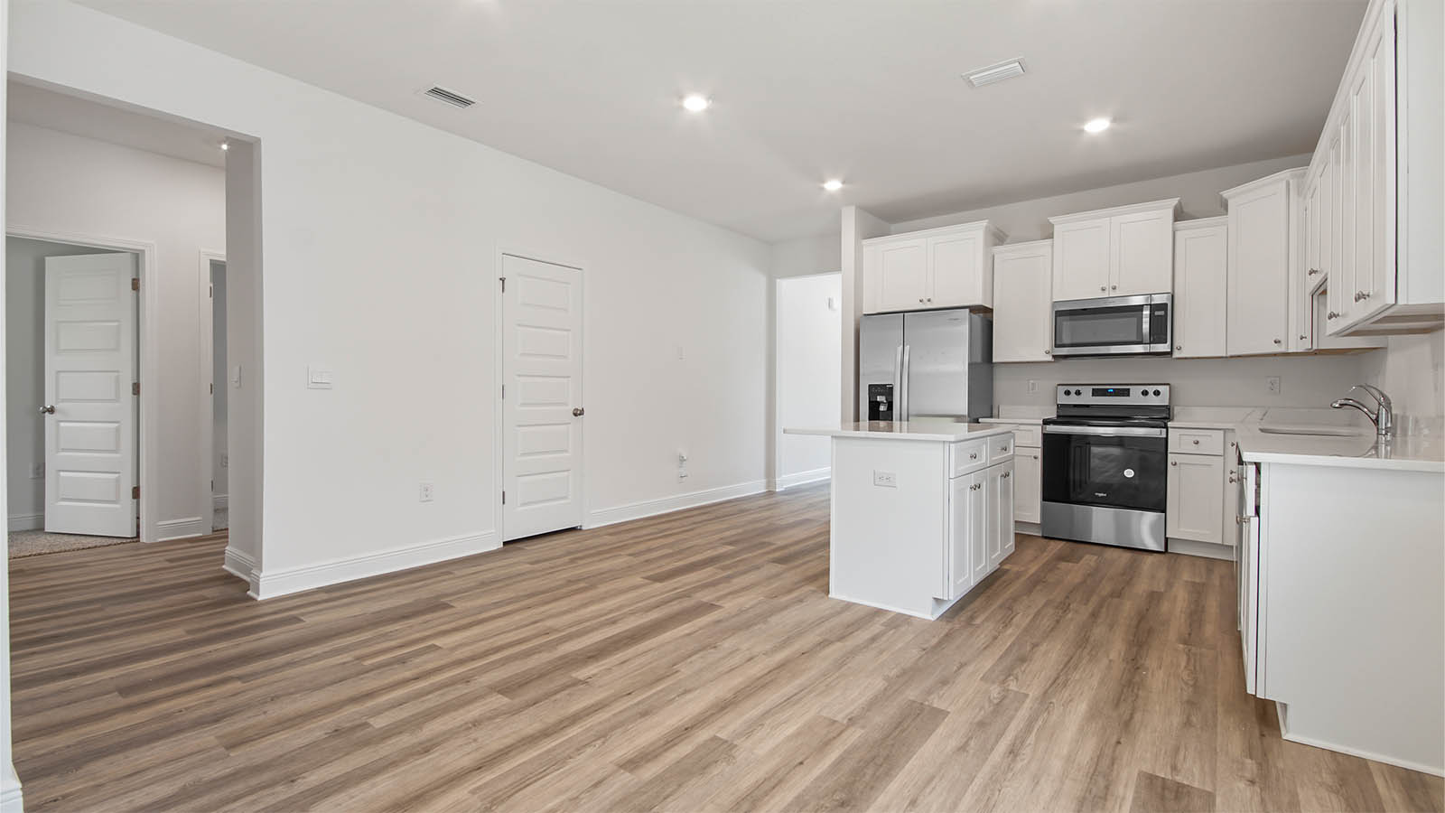 The open kitchen creates a seamless connection between rooms