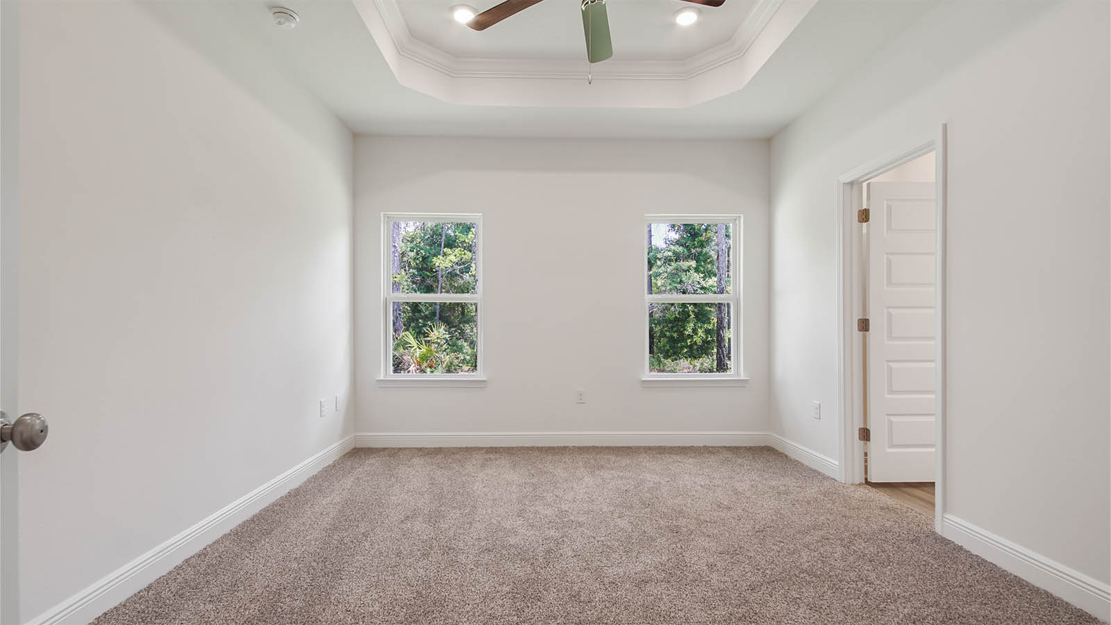 The primary bedroom of the Oakley floor plan