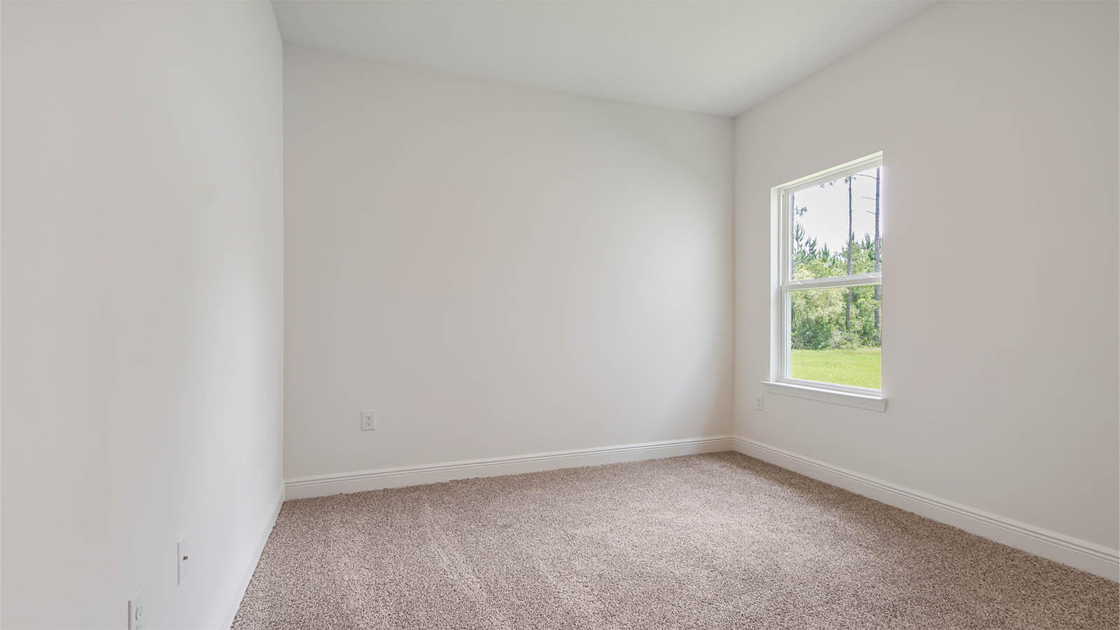 Bedroom two with a window and carpeted flooring.