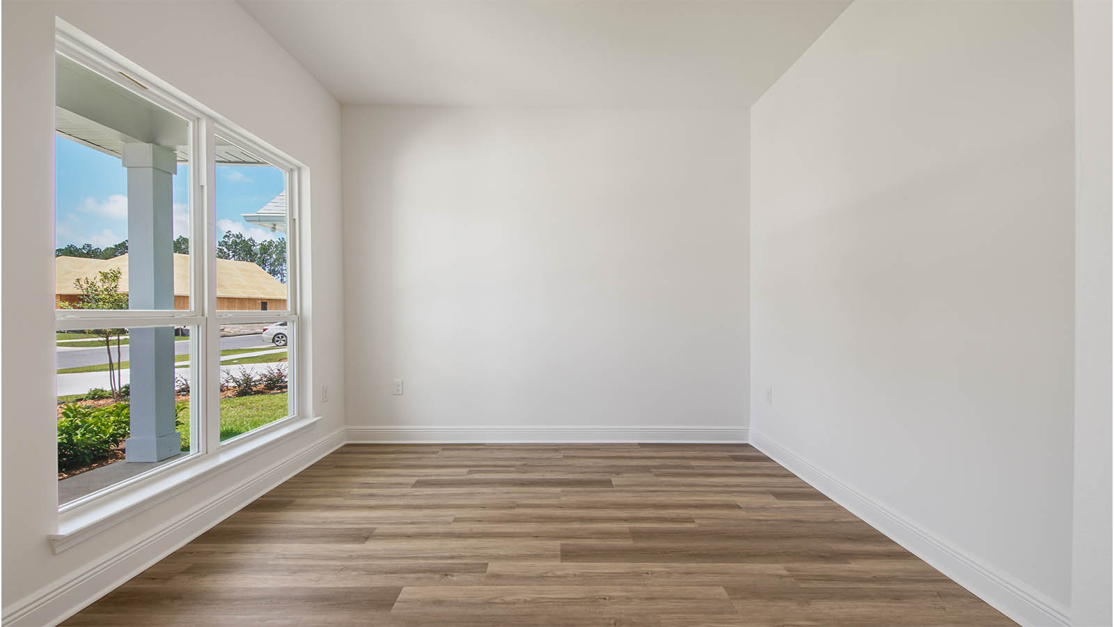 The study has a picture window creating a light filled room
