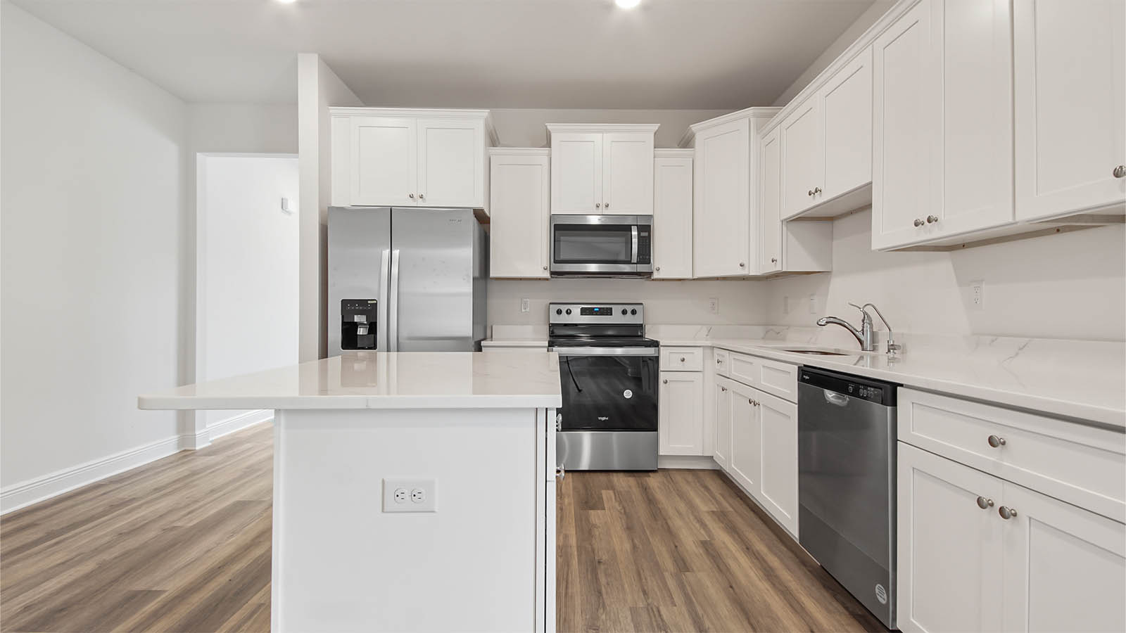 The kitchen has a center island with space for bar seating