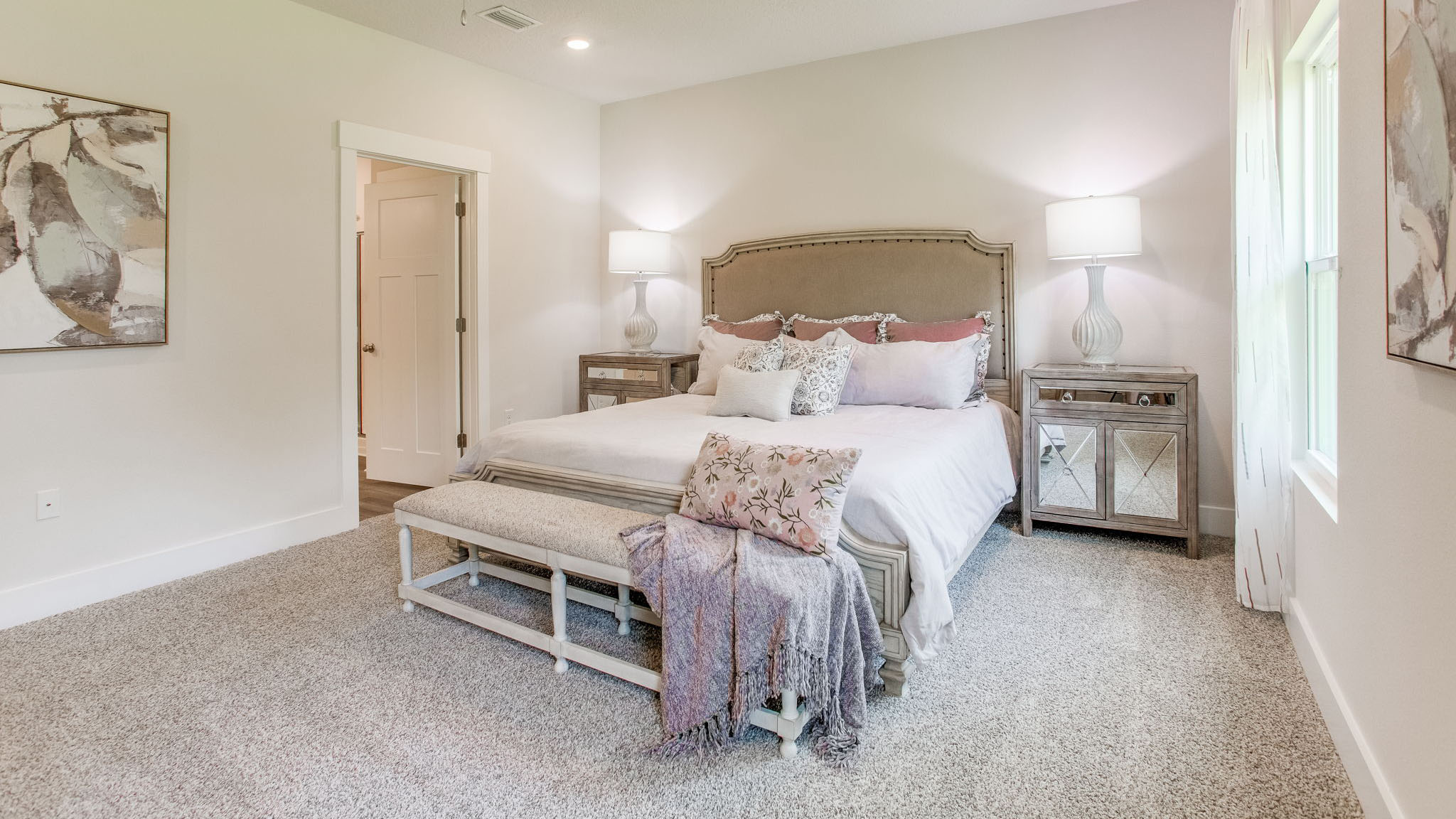 The primary bedroom has carpet and is accessed from the dining area