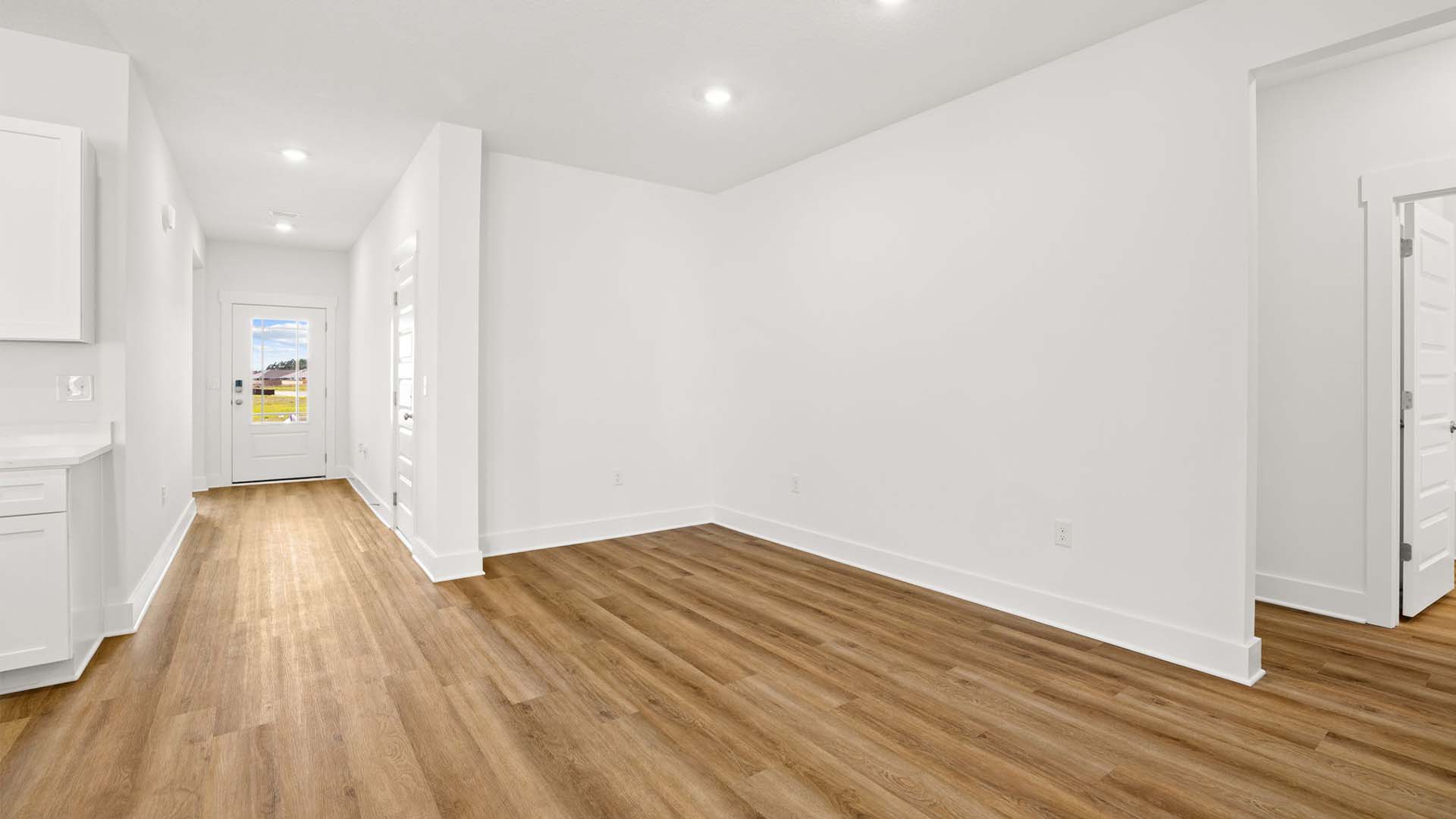 The dining area is located near the entry hall and foyer