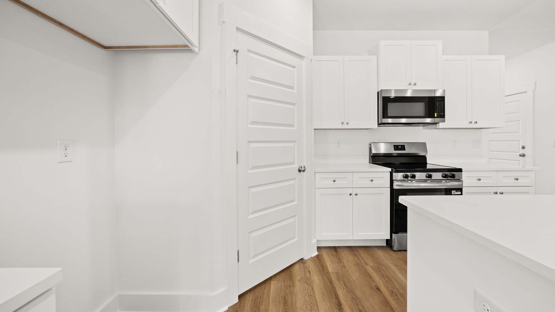 There is a corner pantry in the kitchen