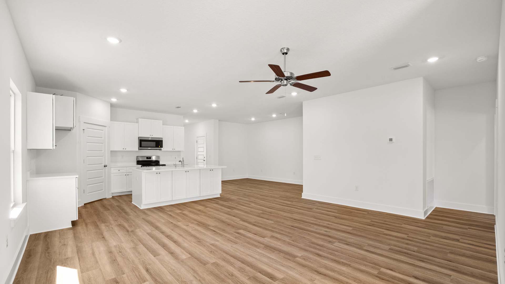 The spacious design in the living allows for comfortable and functional living for family or guests