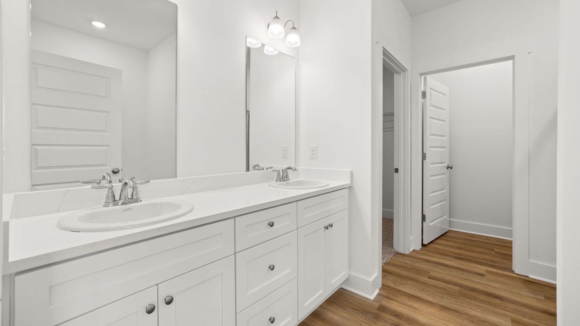 The primary bedroom has a large ensuite bath