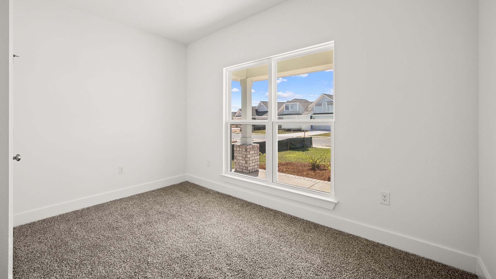 Guest bedroom two is located at the front of the home