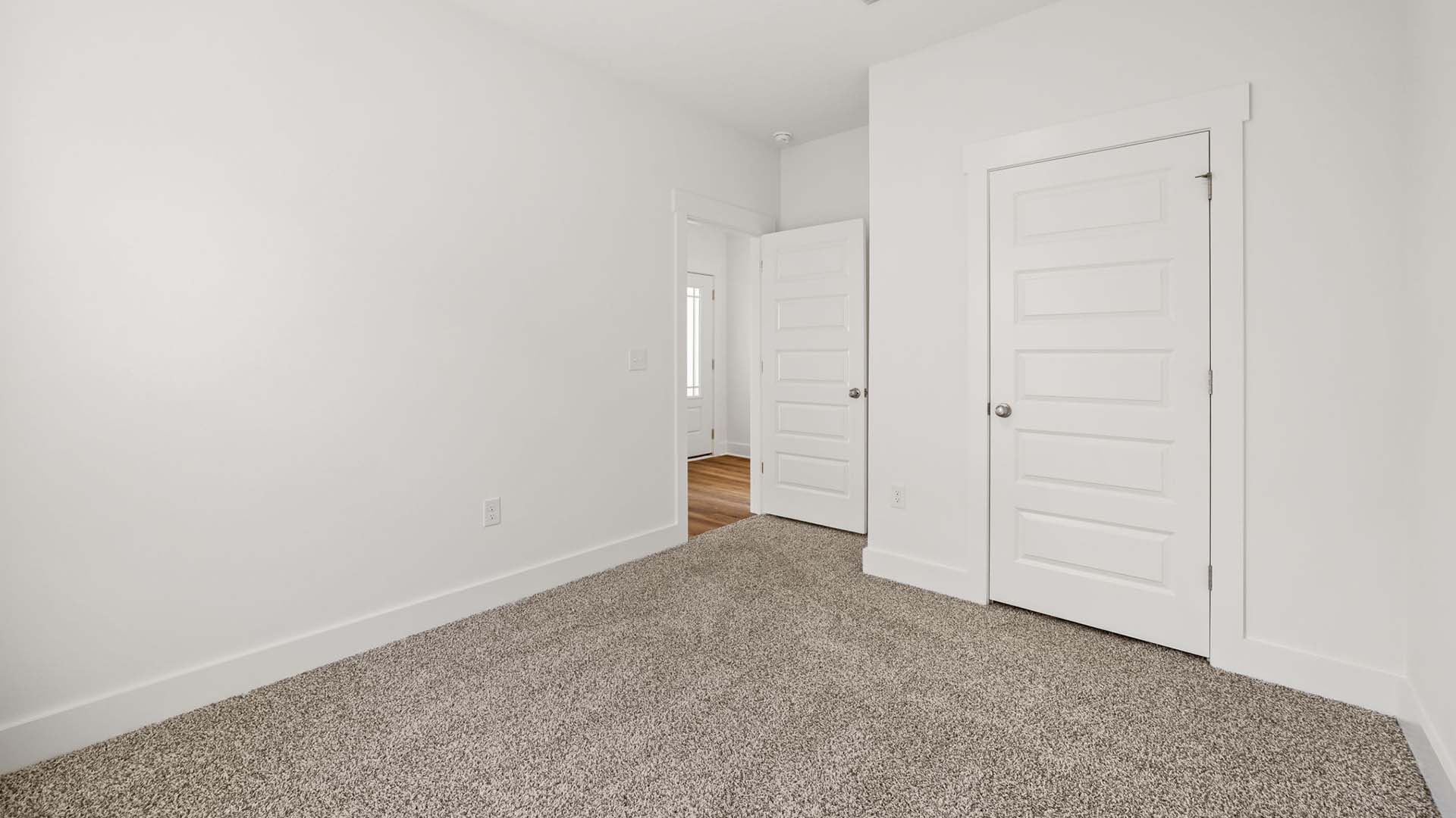 Two more guest bedrooms are off the dining area