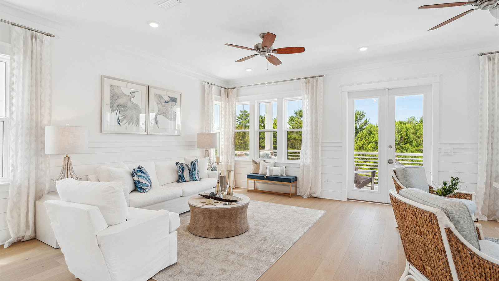 The second level is open and spacious with expansive windows allowing for natural light