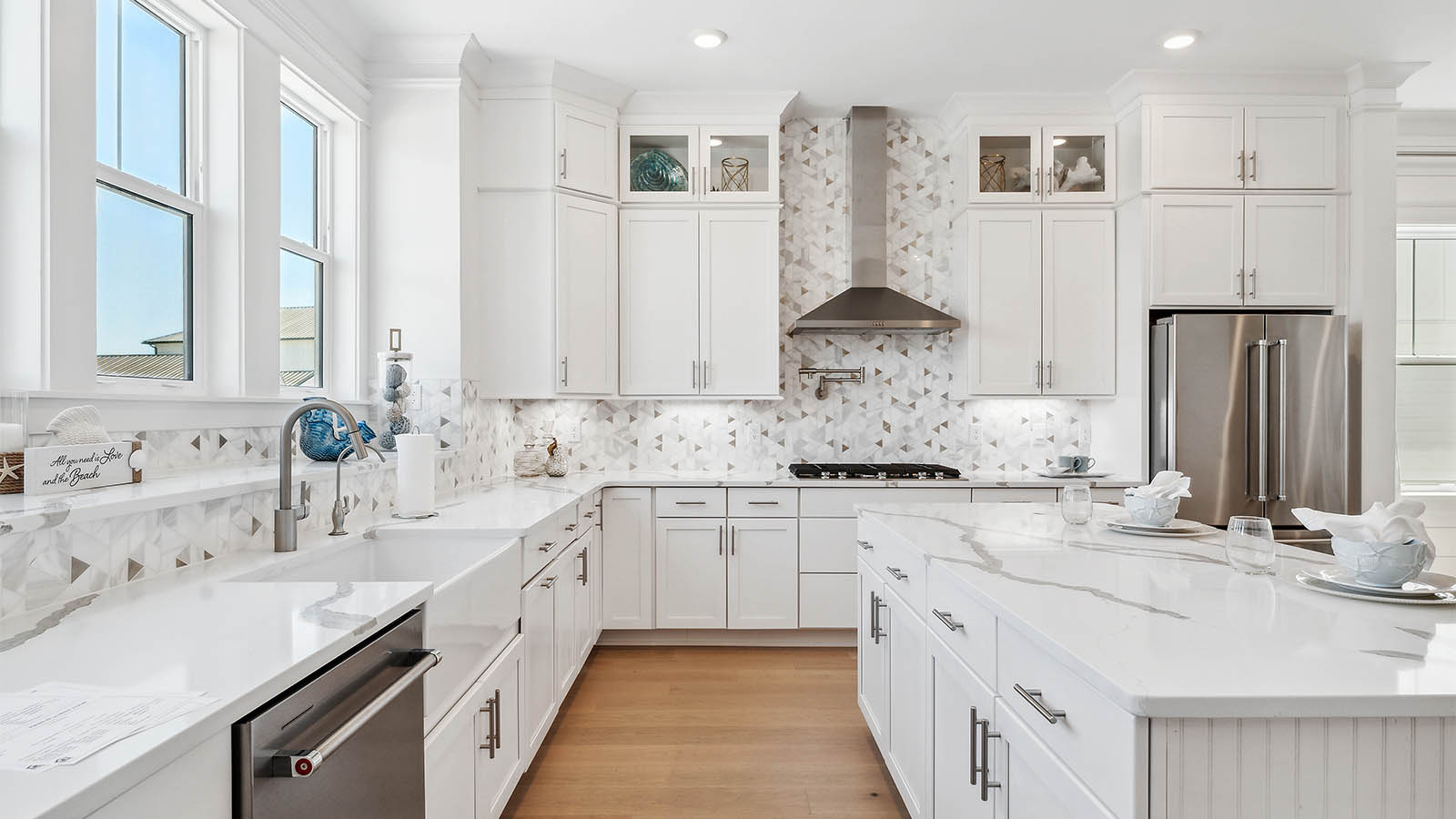 The kitchen has plenty of upper and lower cabinetry for storage