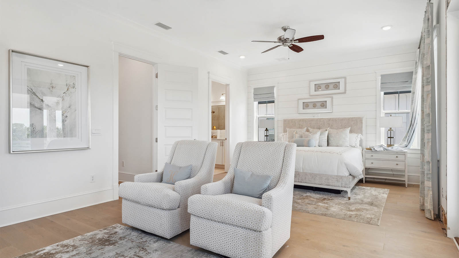 The primary bedroom has space for a king size bed and sitting area