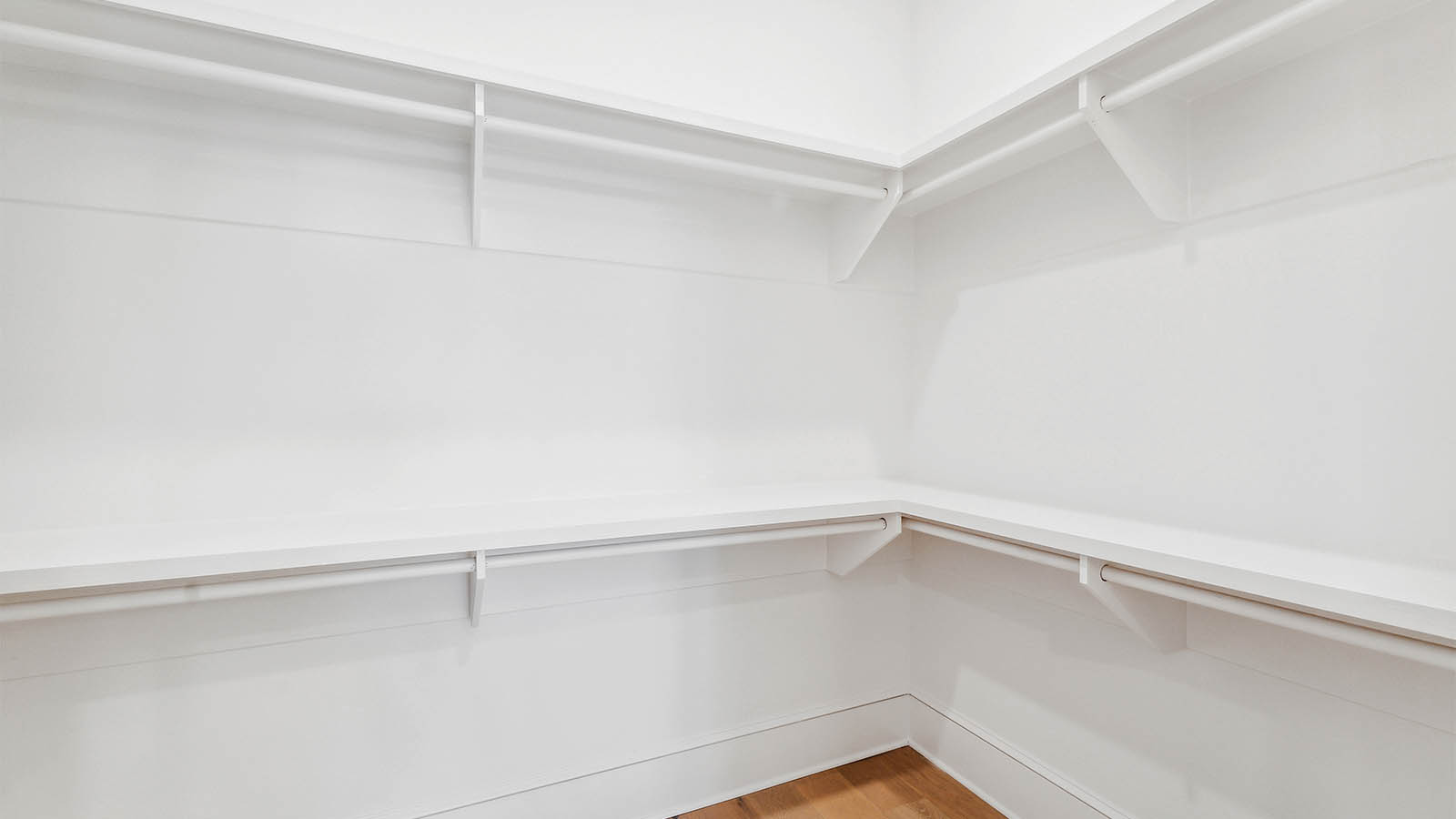 The spacious closet has space for storage and wardrobe needs