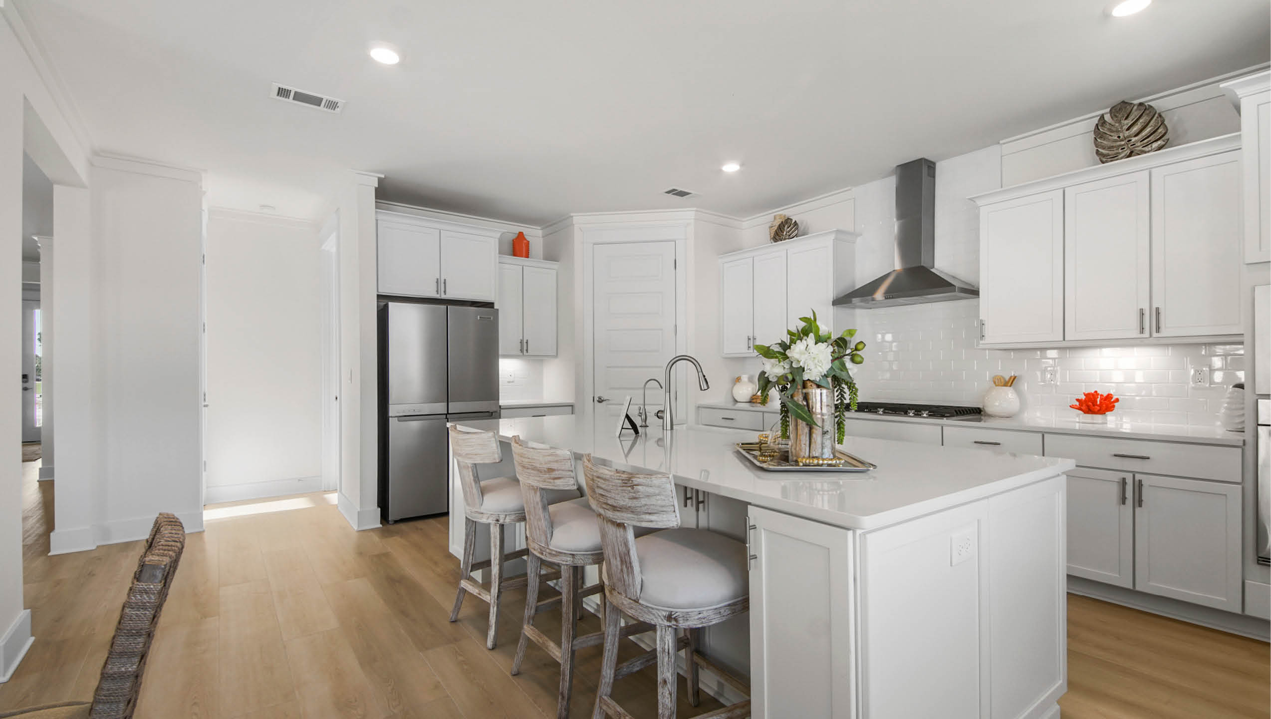 Open kitchen with center island with room for bar seating