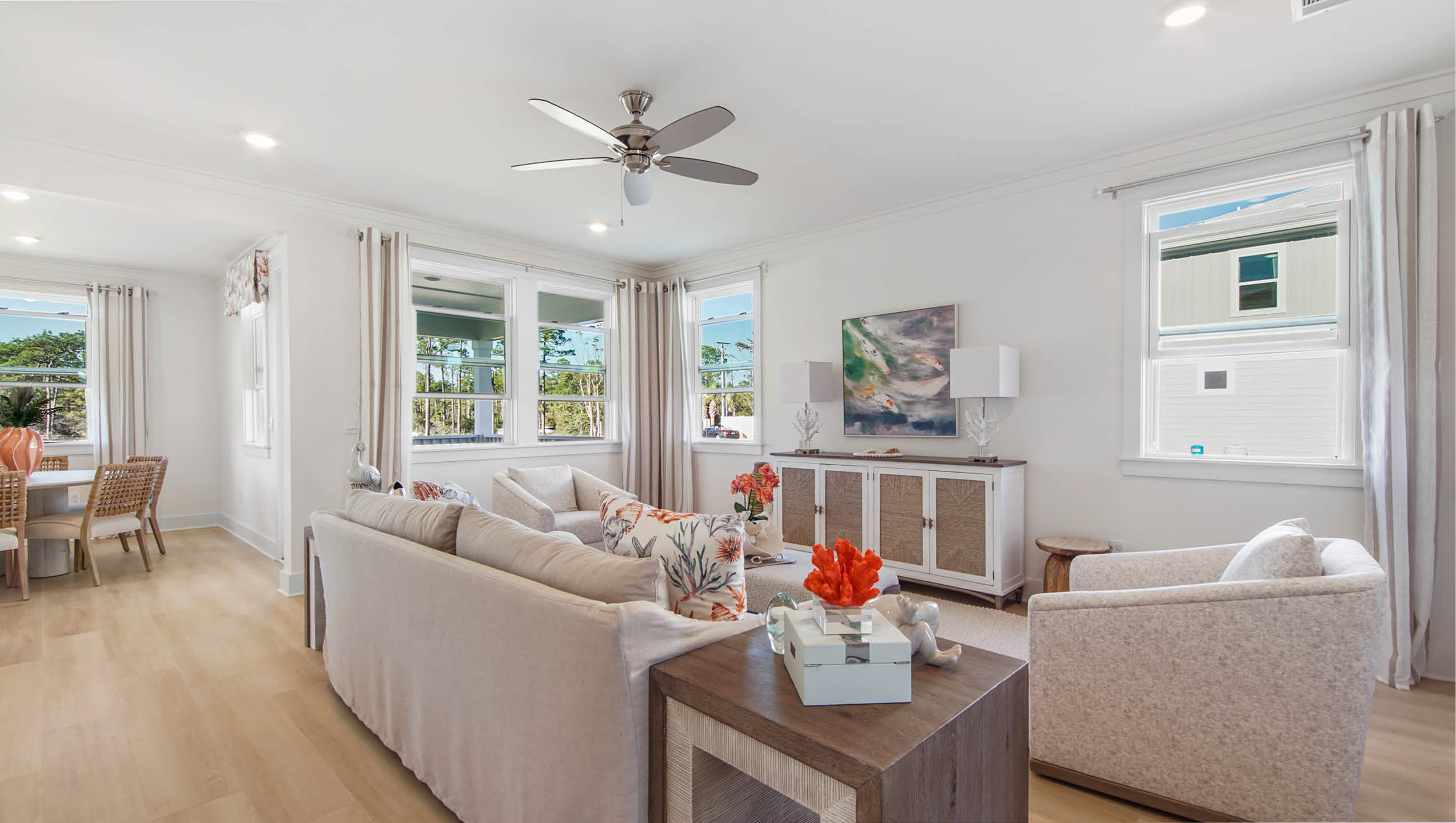 Open concept main level living area that has been elegantly designed with windows creating a light filled space.