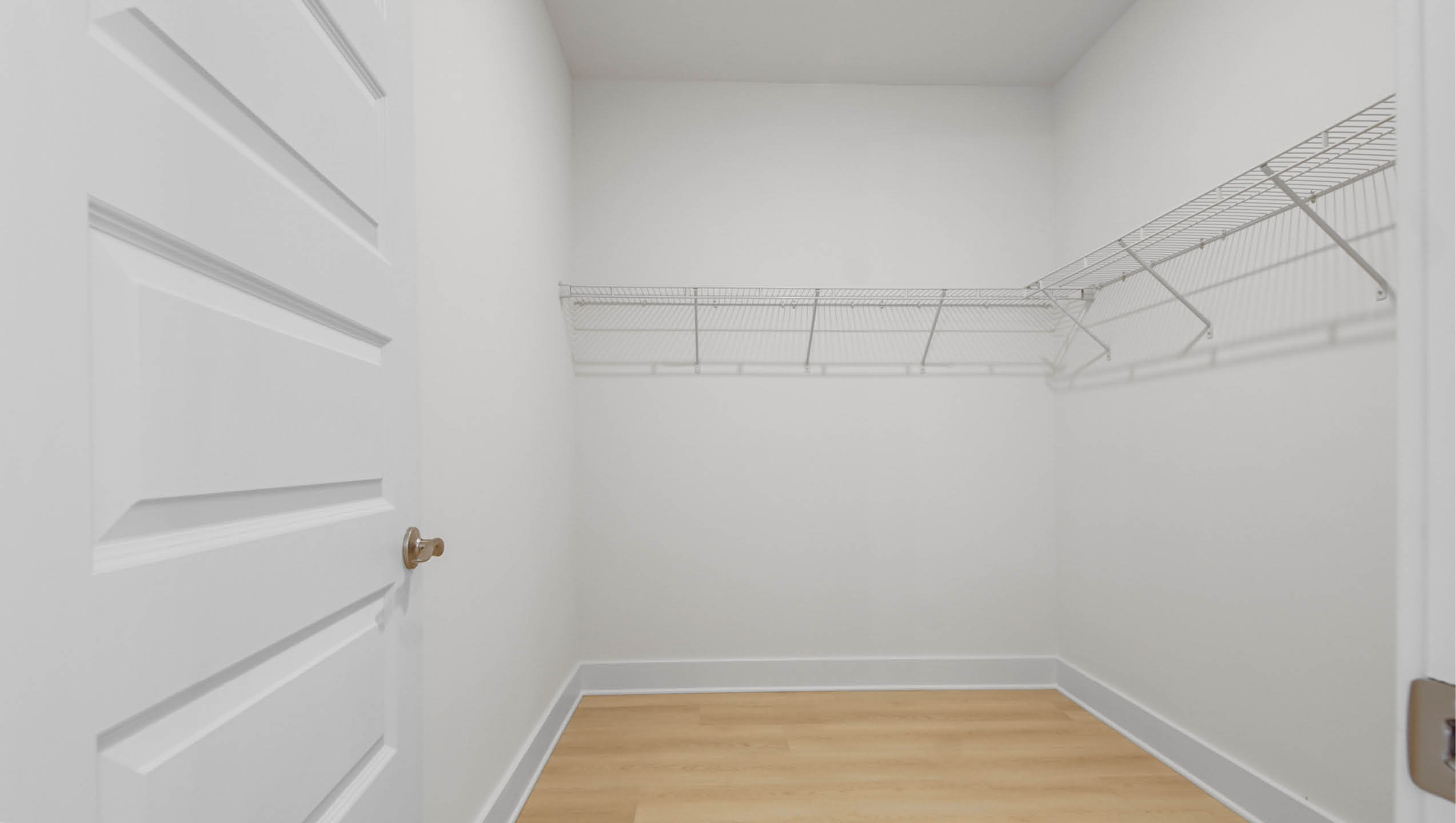 Primary bathroom with open shower and glass partition